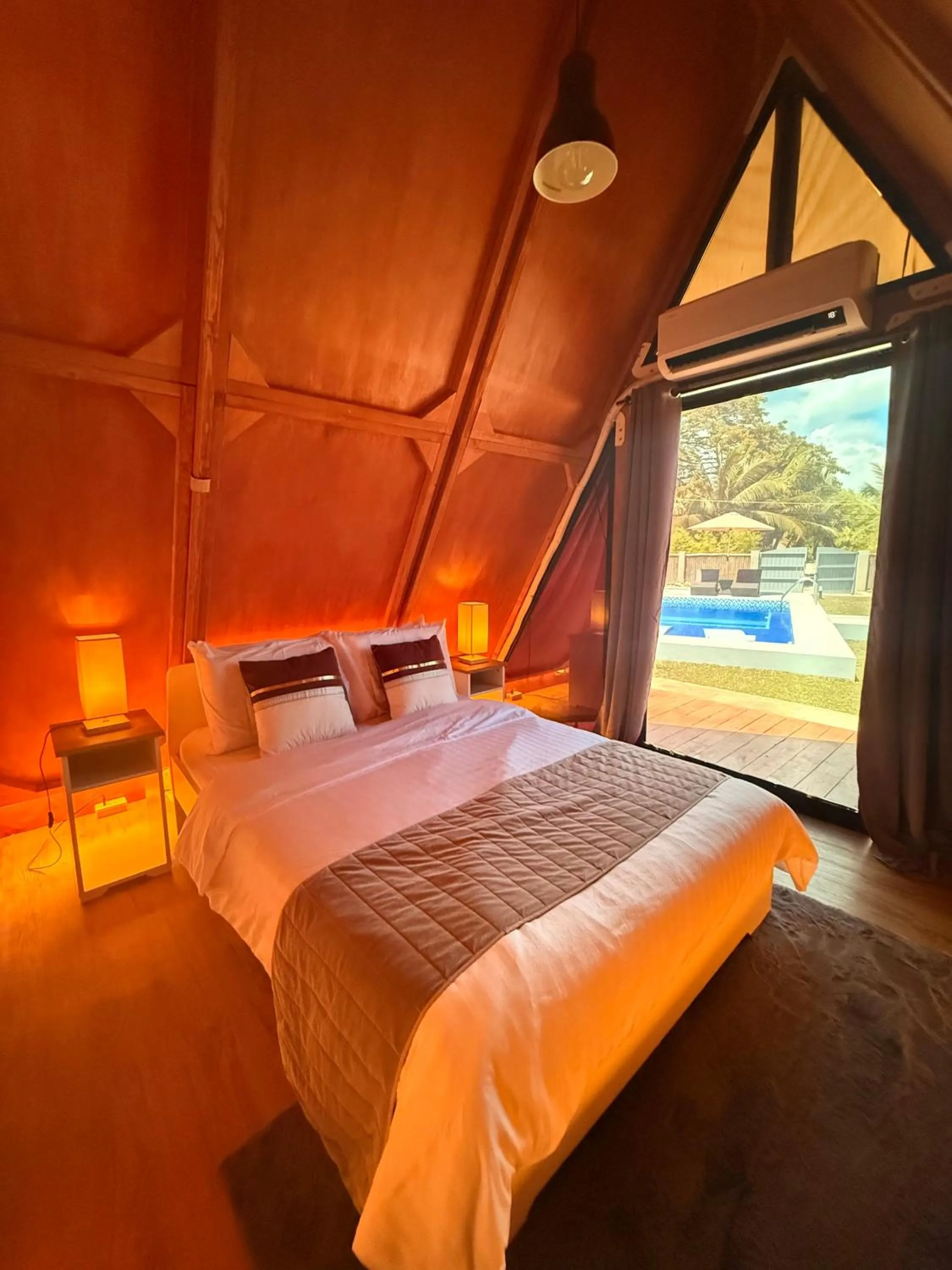 Bed in Aquamare Beach Camp Resort