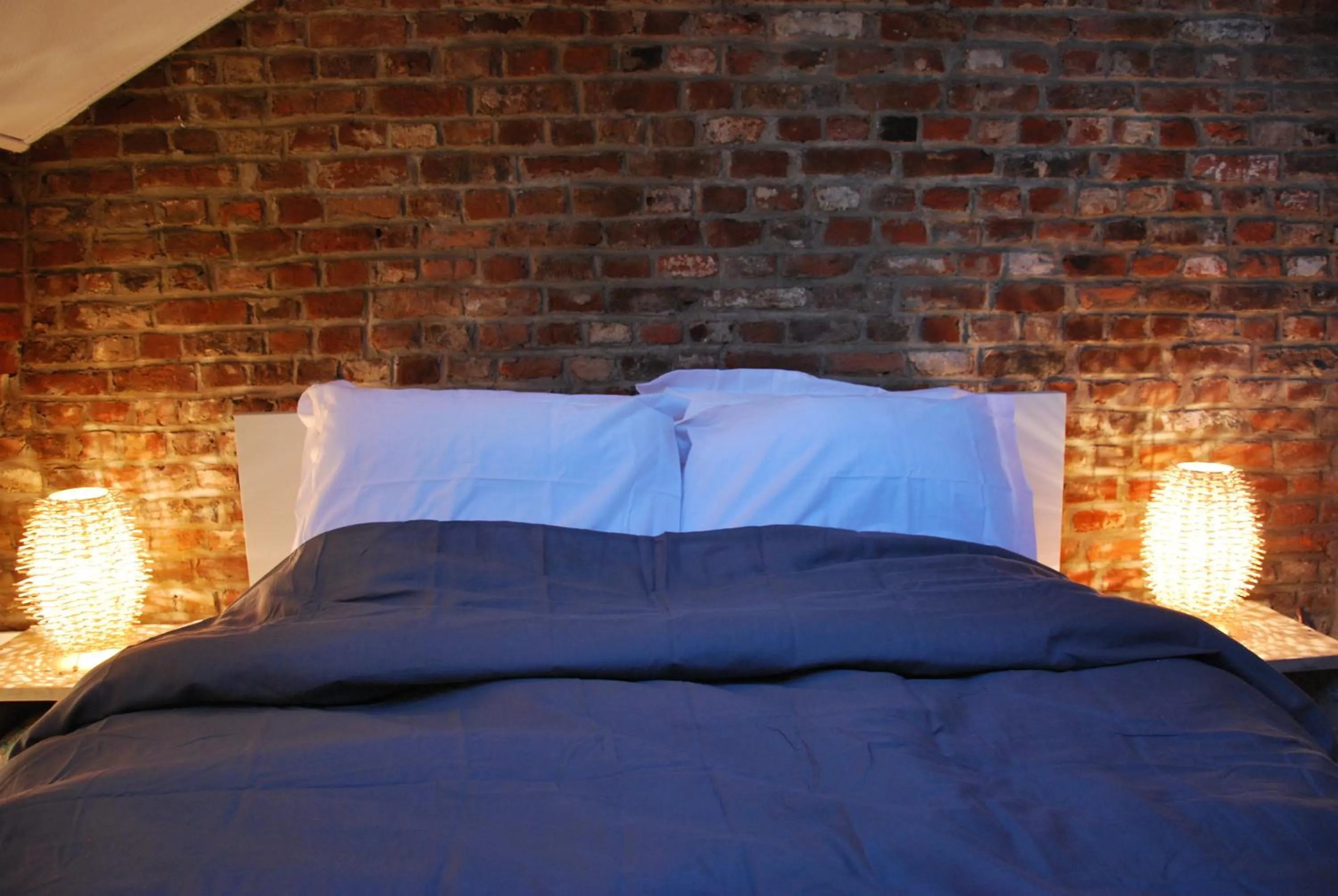 Photo of the whole room, Bed in Les studios de la grand Place