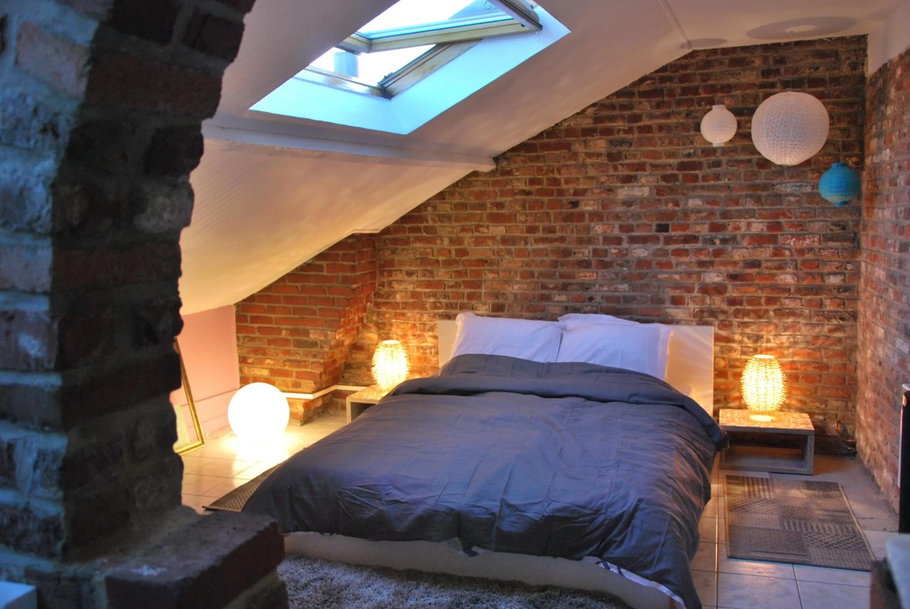 Photo of the whole room, Bed in Les studios de la grand Place