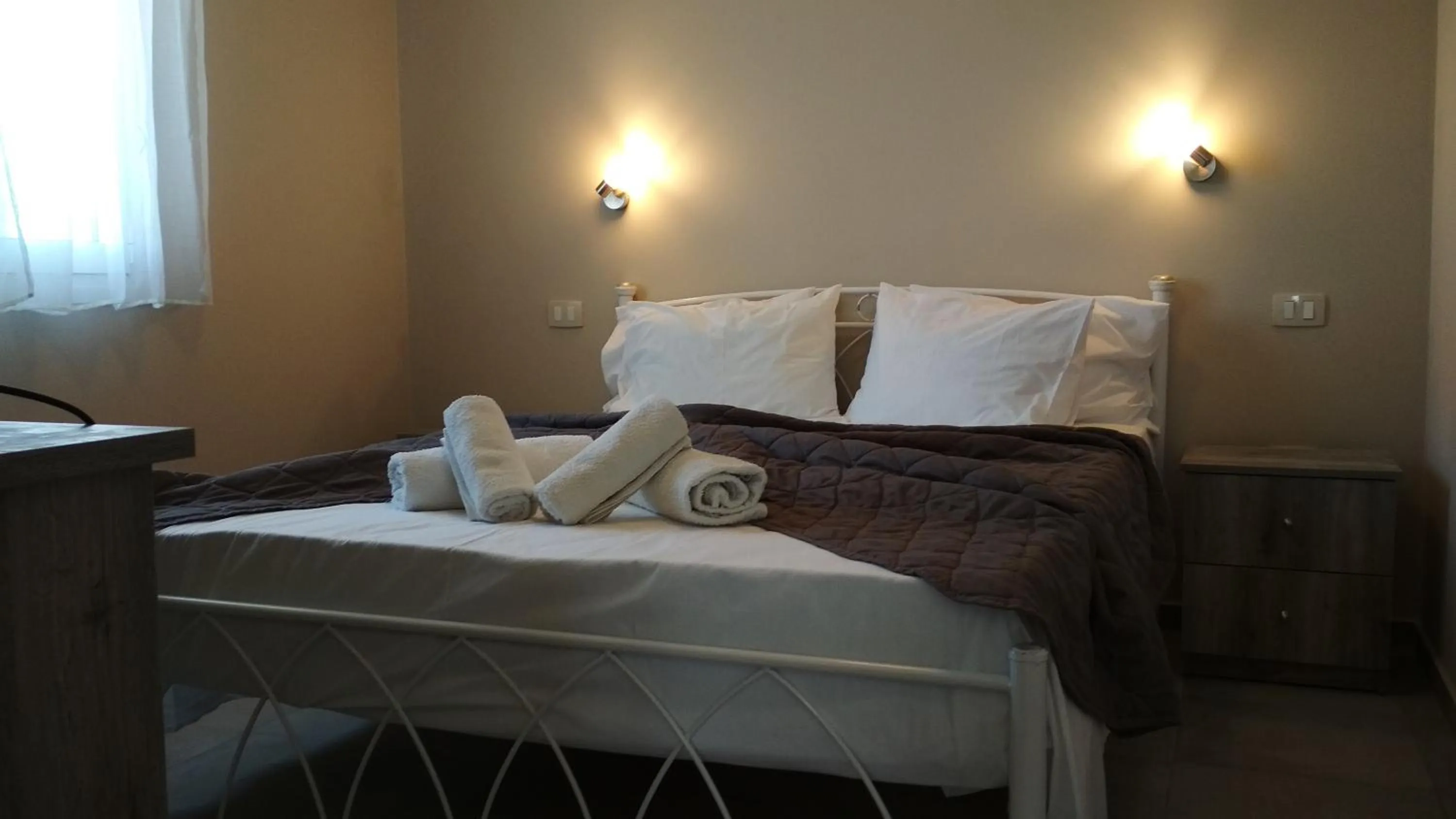 Bed in Casa De Rosa Apartments & Studios