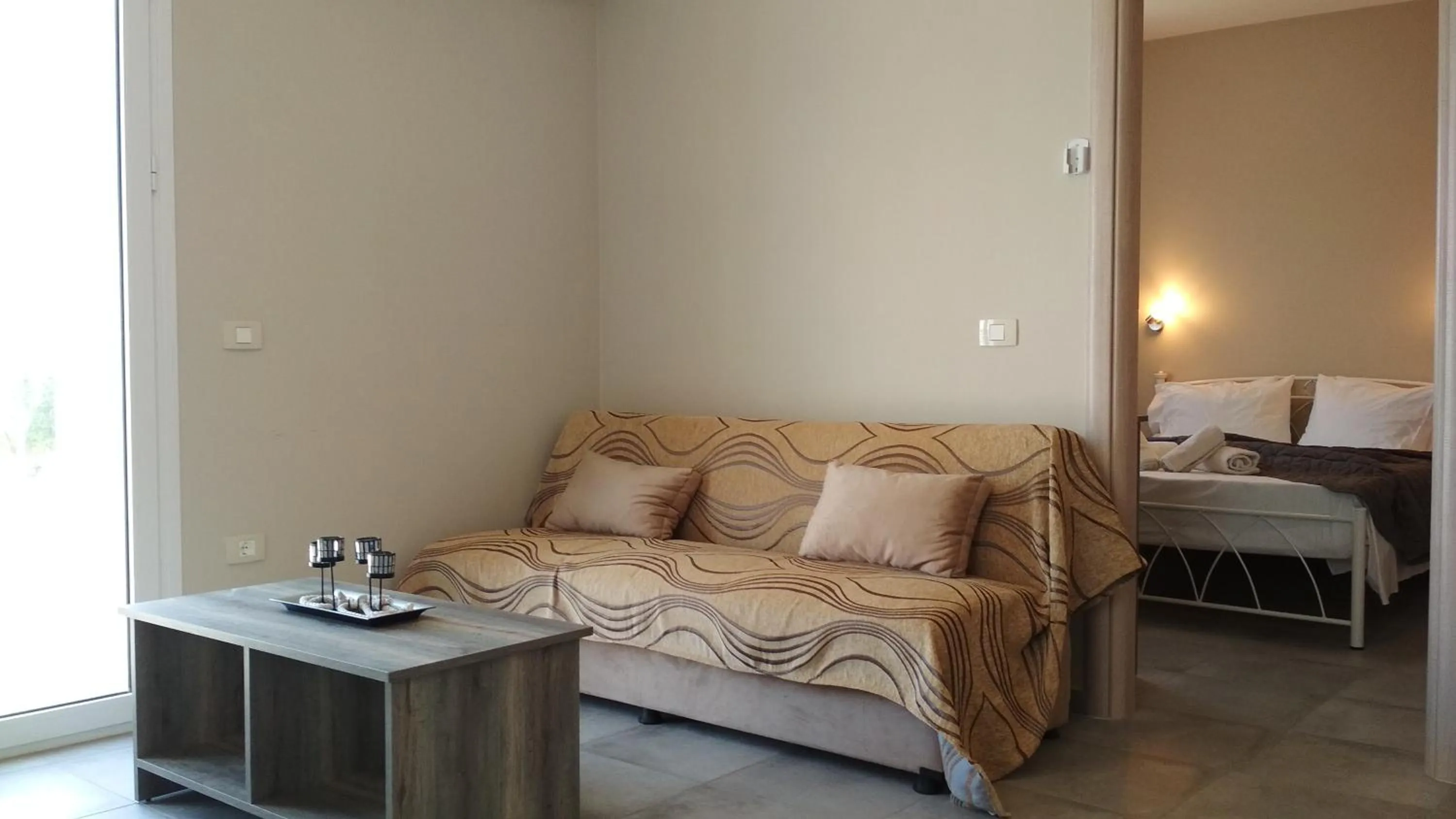 Living room, Bed in Casa De Rosa Apartments & Studios