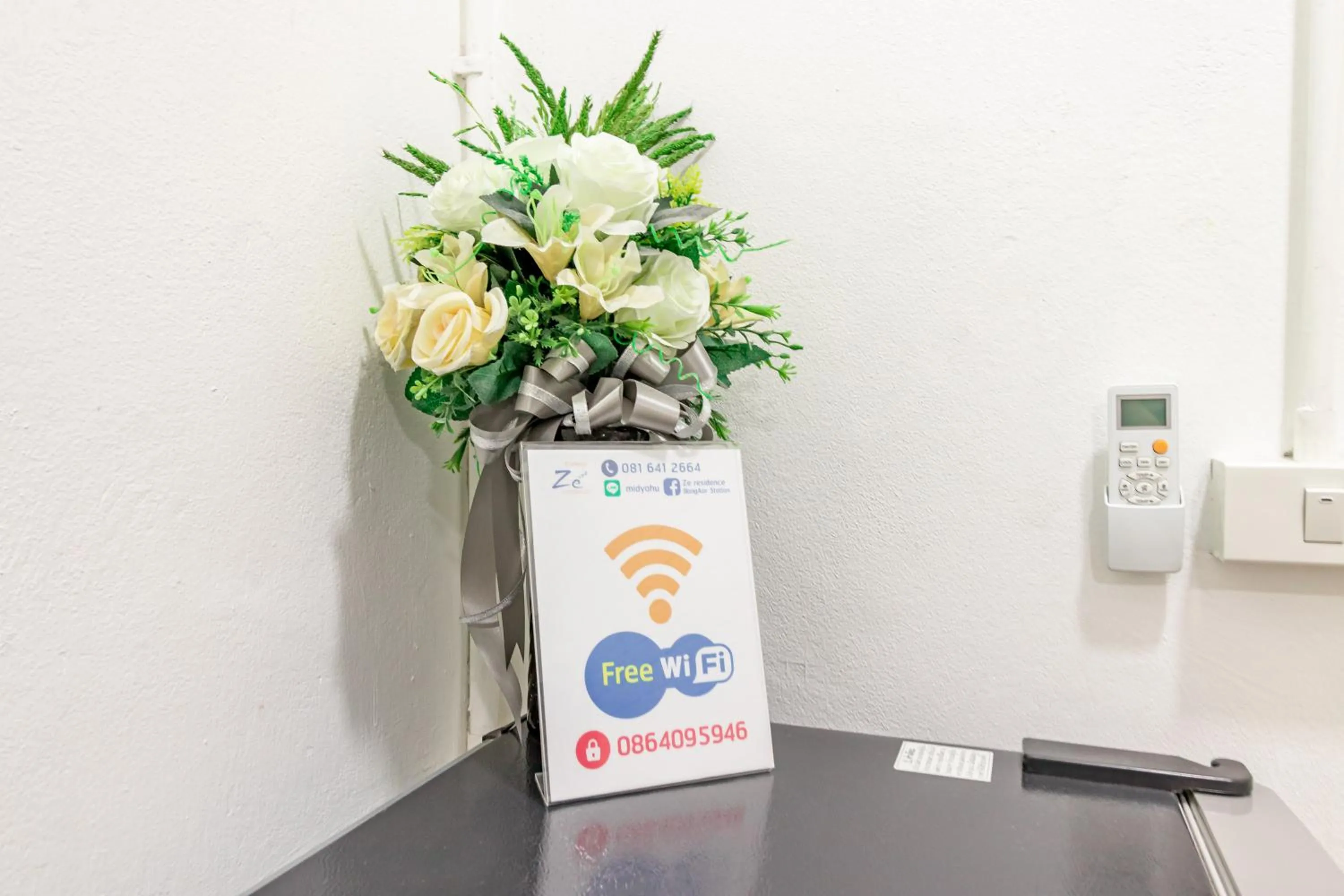 Property logo or sign in Ze Residence Bang Aor Station