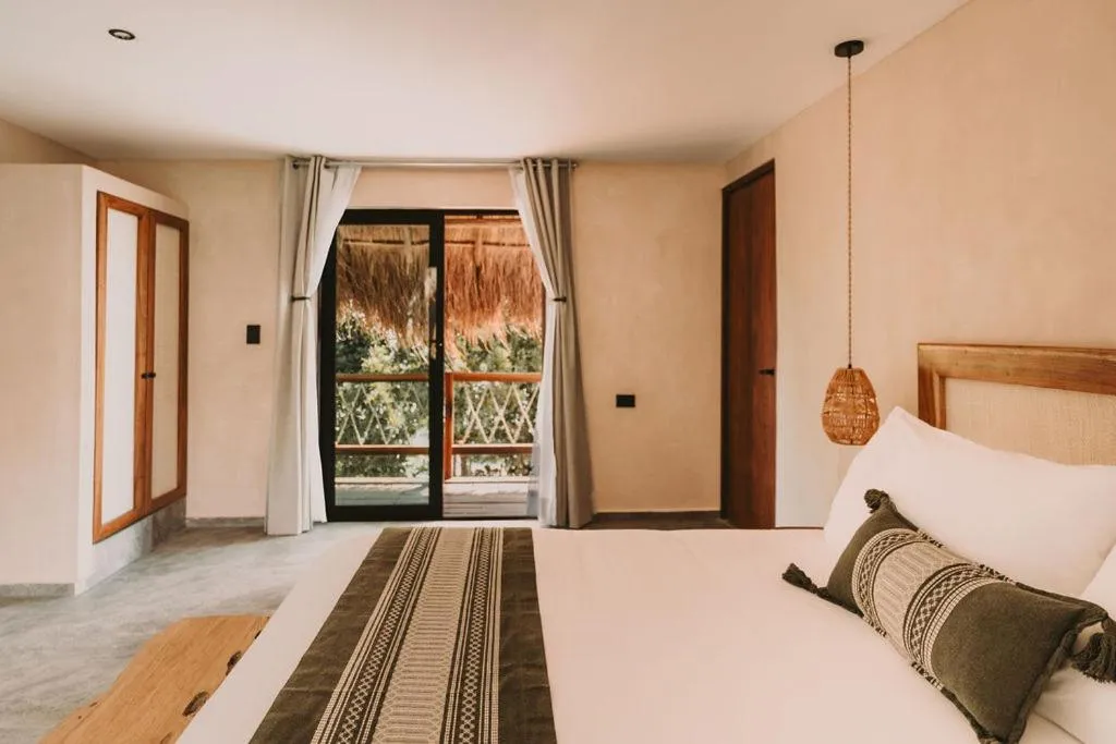 Bed in Zelune Luxury Lagoon Resort Bacalar - Adults Only