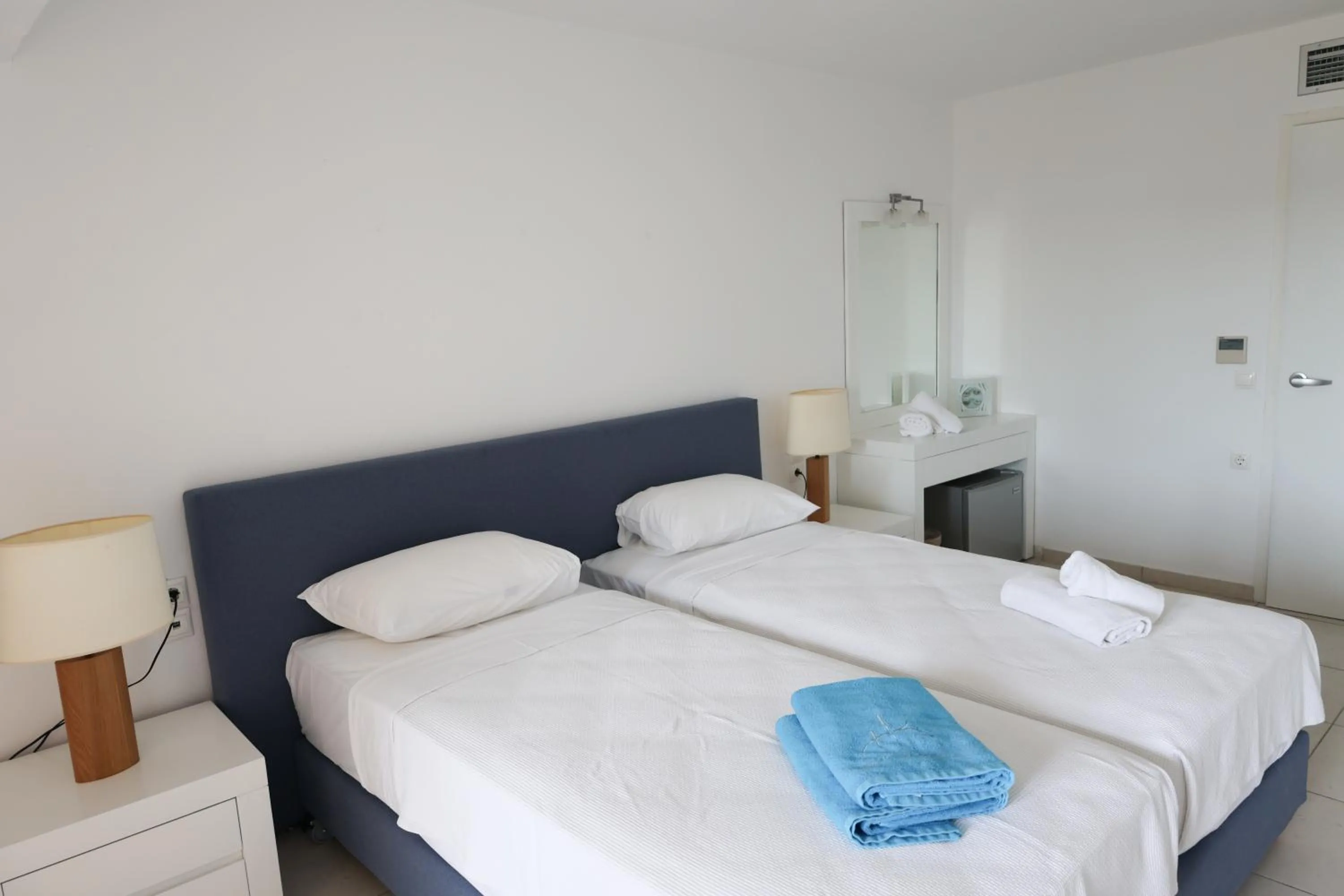 Bed in Cape Kanapitsa Hotel & Suites