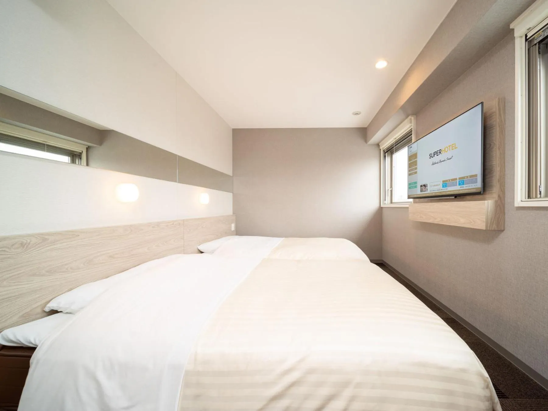 Bed in Super Hotel Premier Obihiro Ekimae