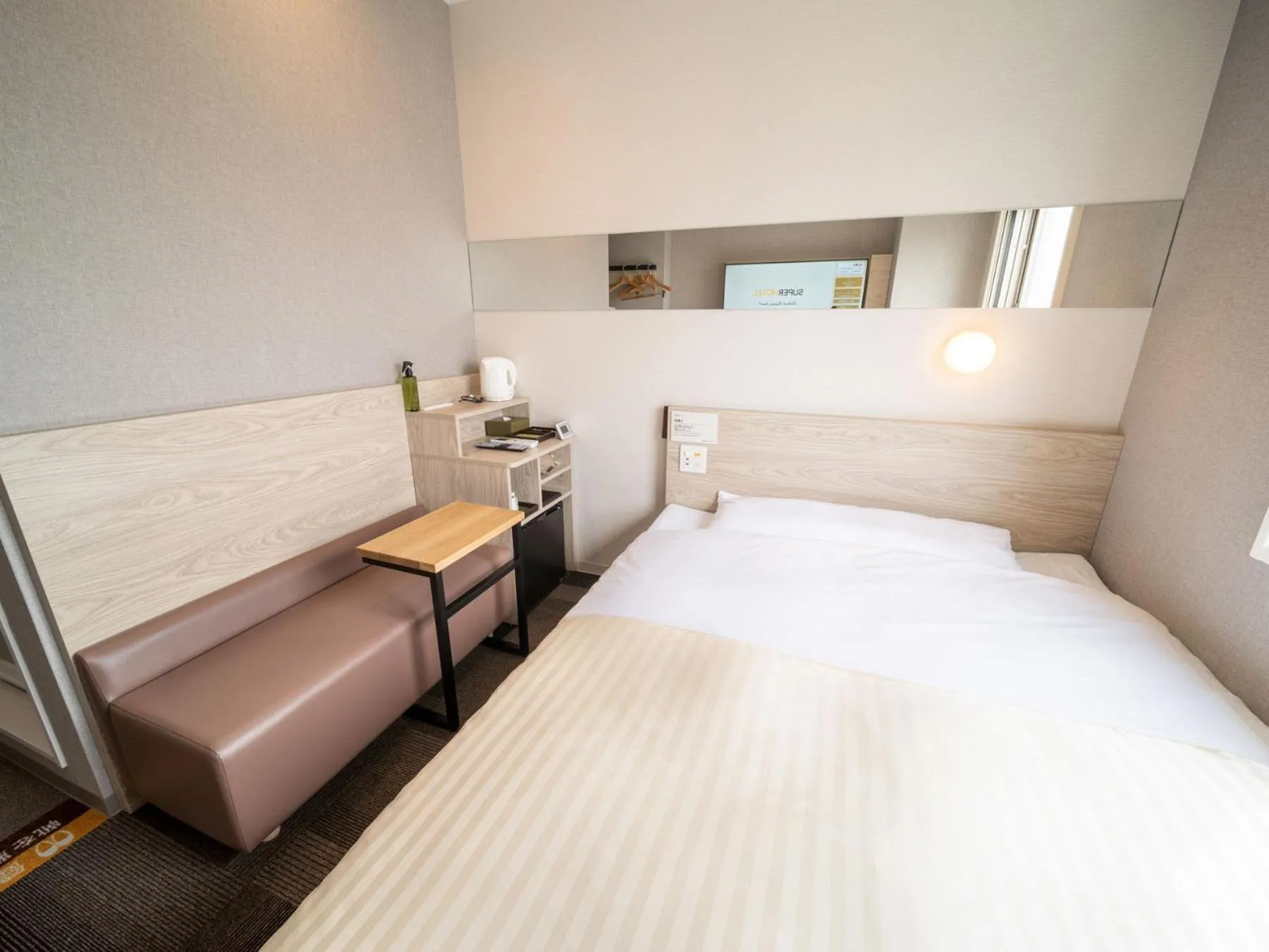 Bed in Super Hotel Premier Obihiro Ekimae