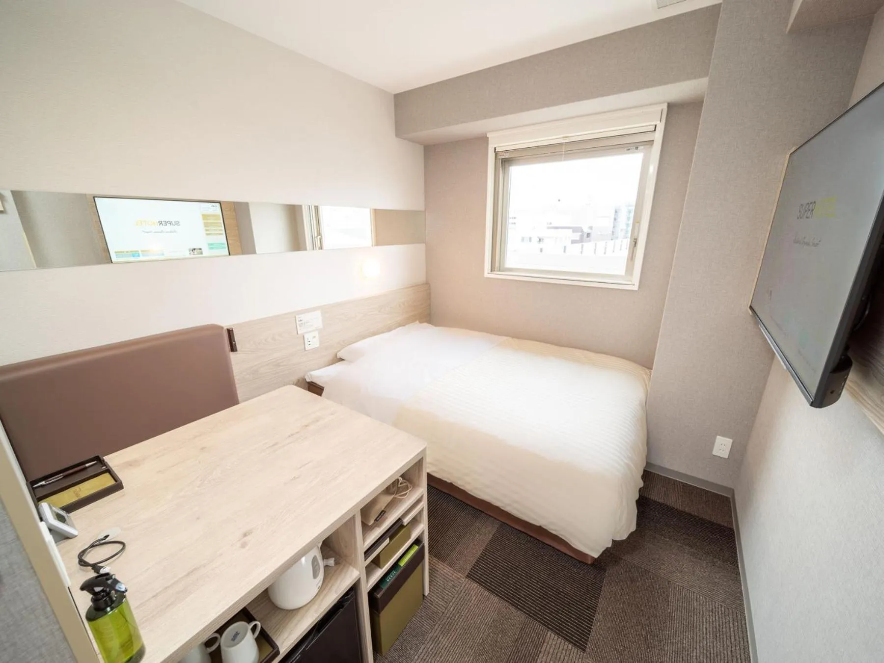 Bed in Super Hotel Premier Obihiro Ekimae