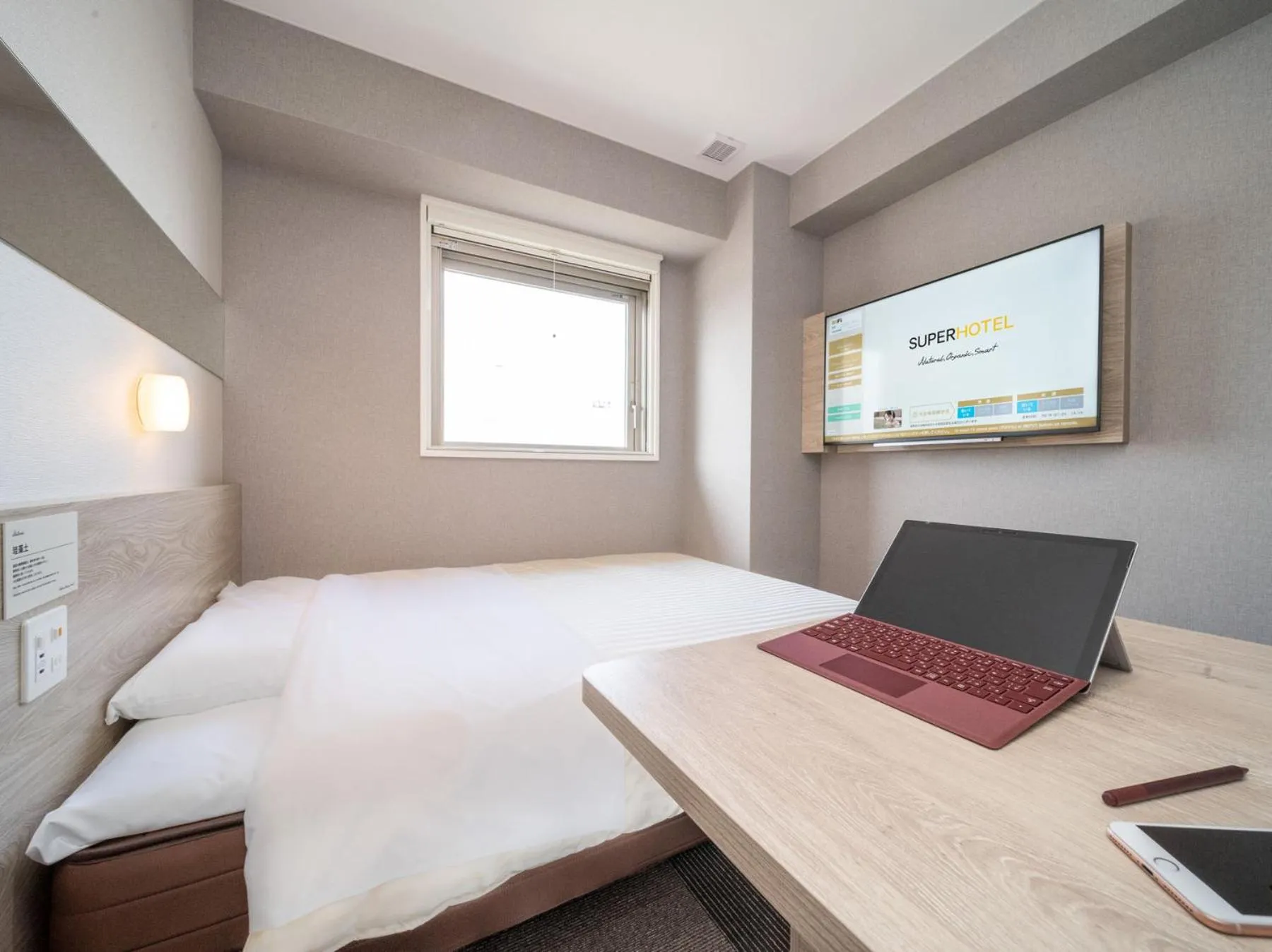 Bed in Super Hotel Premier Obihiro Ekimae