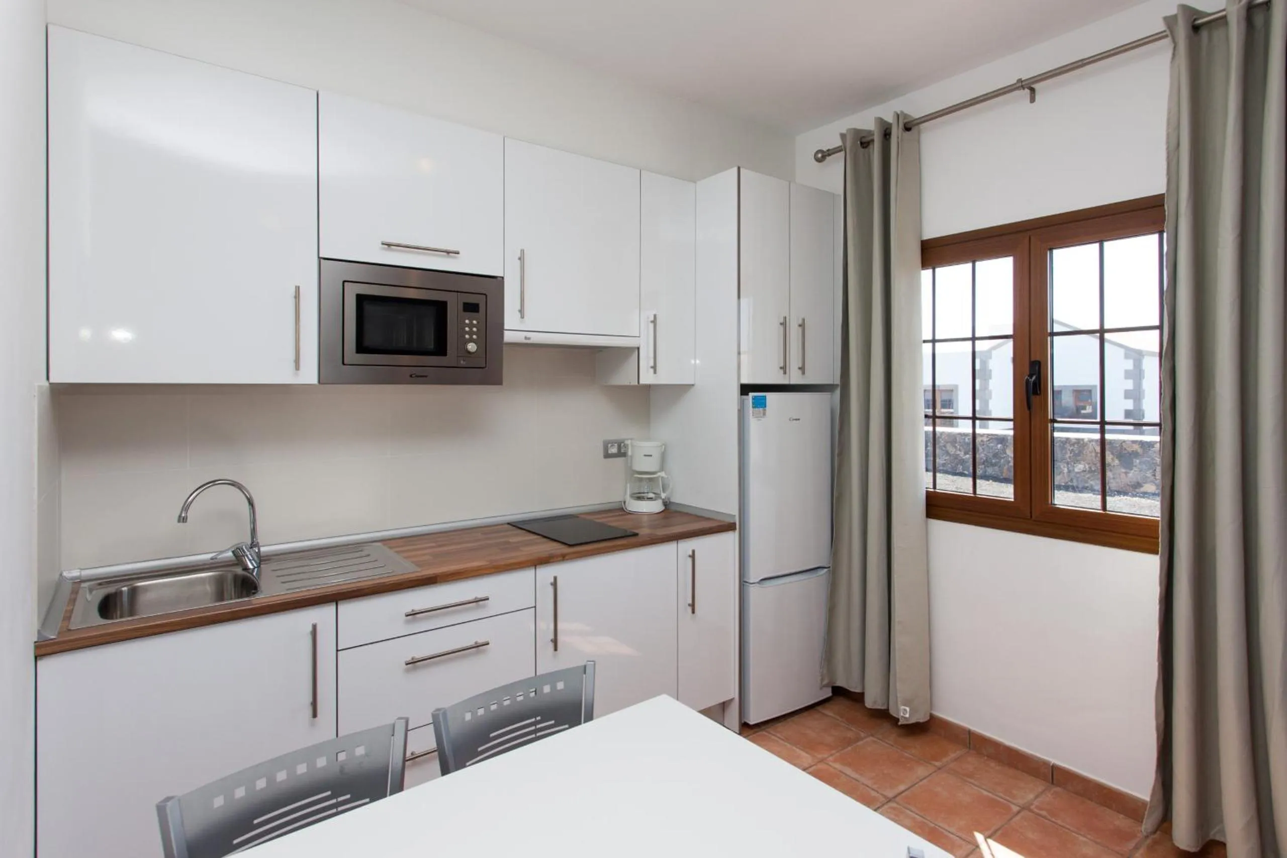 Kitchen or kitchenette in Villas & Apartamentos Tao Mazo