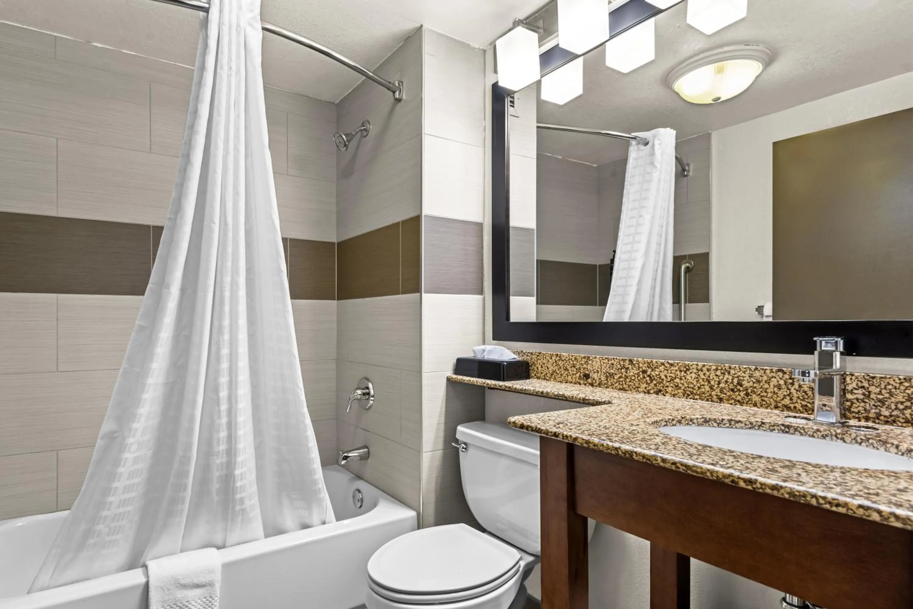 Shower in Hotel Concord Syracuse, an Ascend Collection Hotel