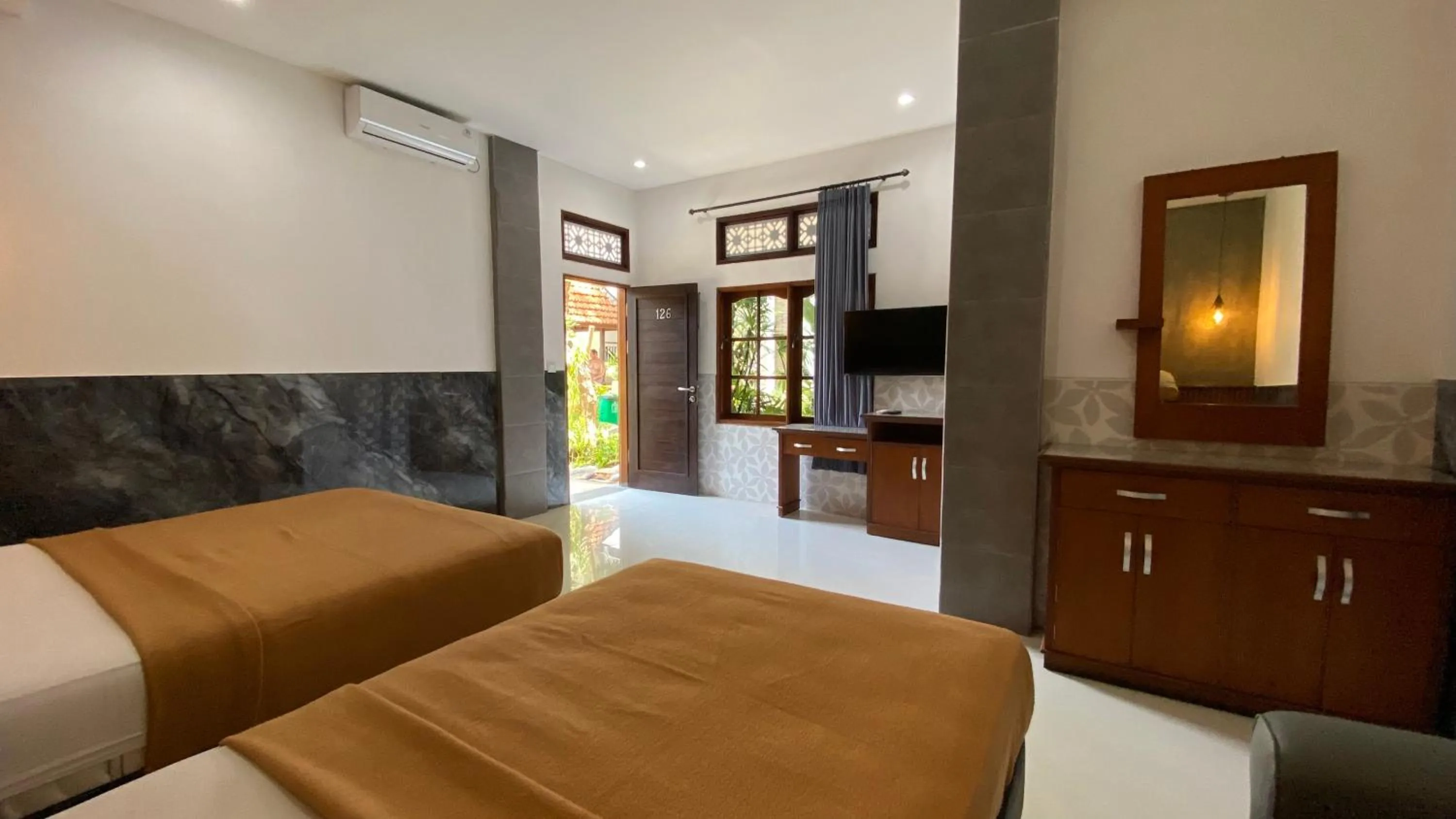 Bed in Sandat Hotel Legian