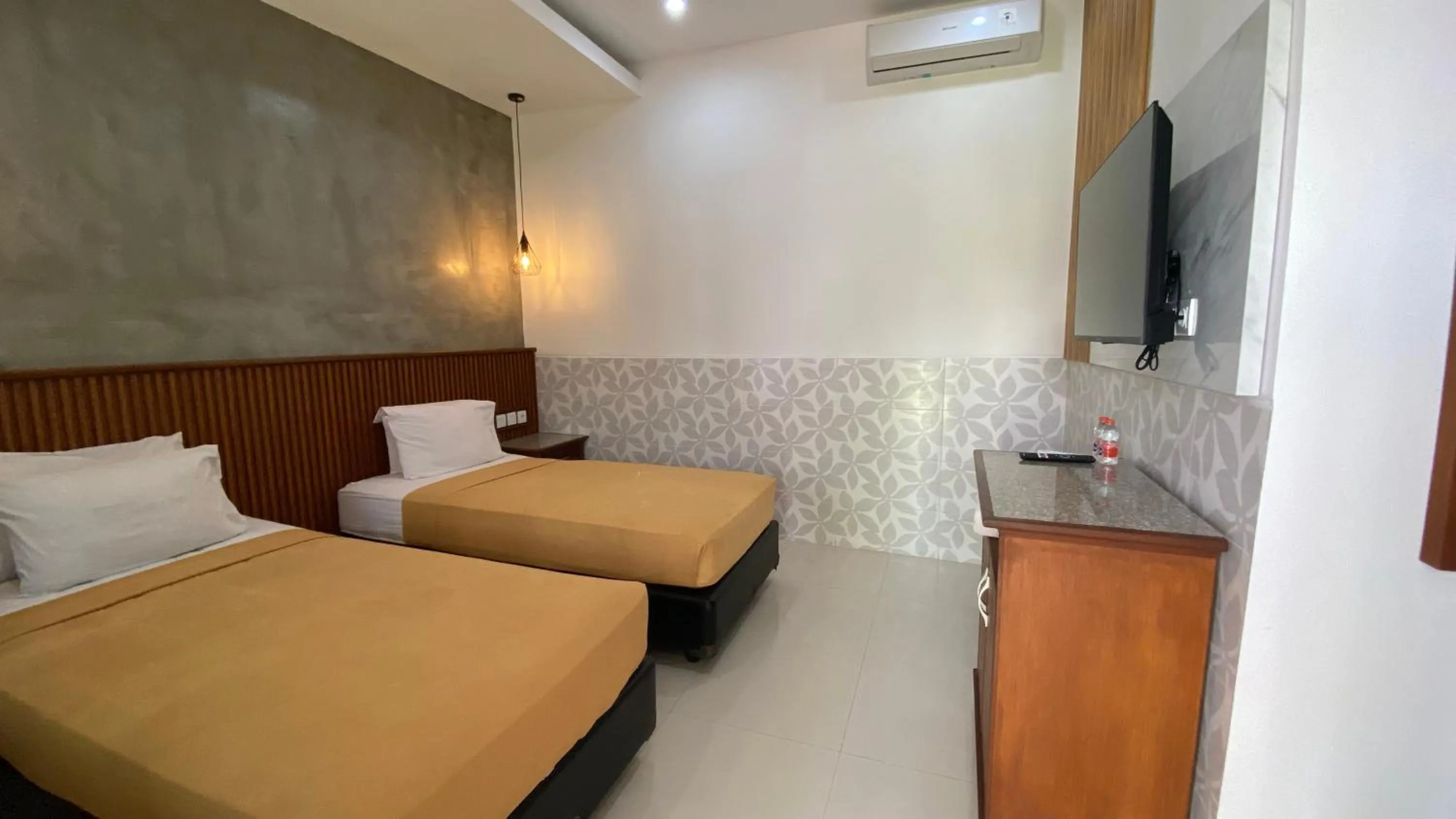 Bed in Sandat Hotel Legian