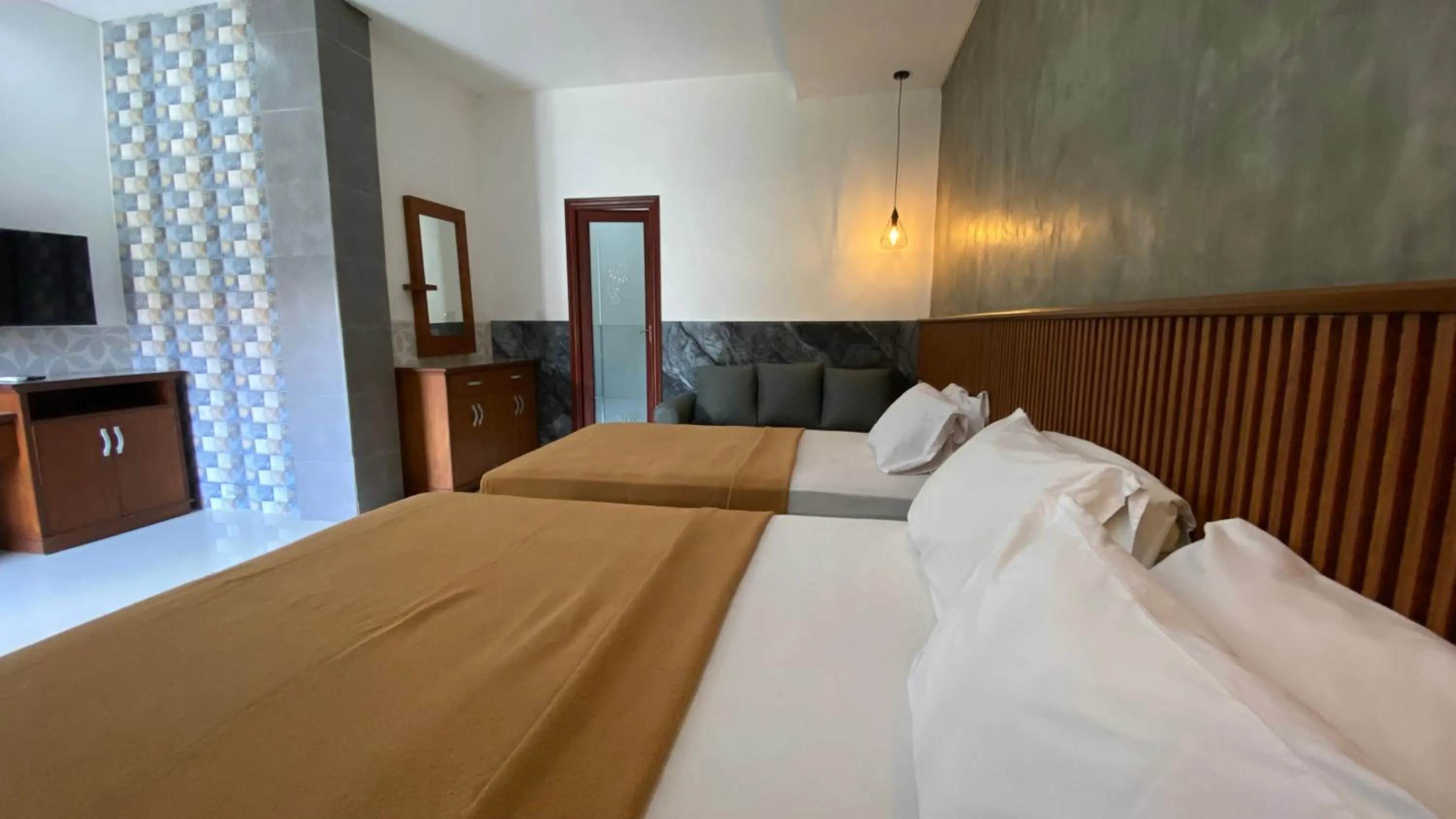 Bed in Sandat Hotel Legian