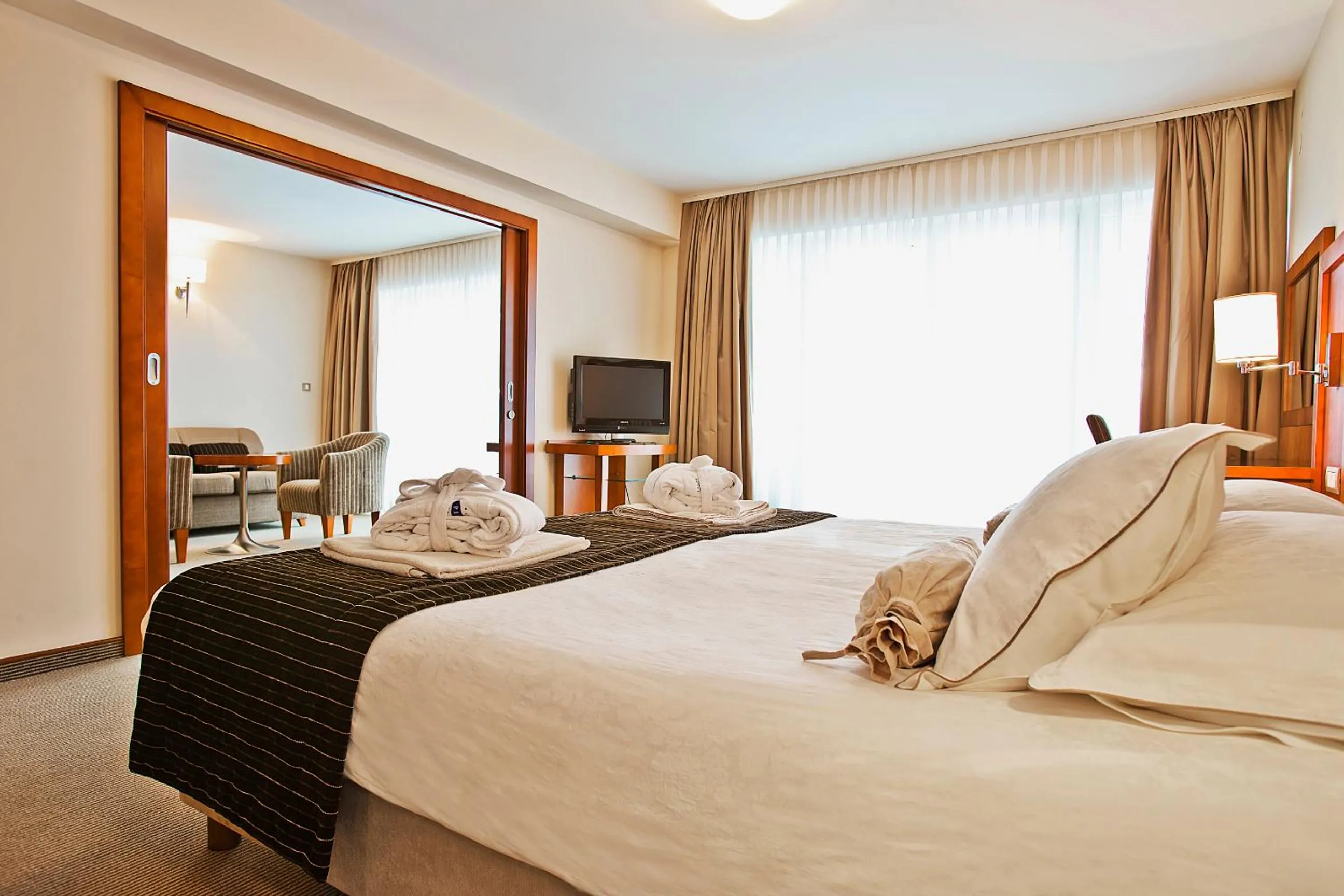 Bed in Spa & Wellness Hotel Pinia