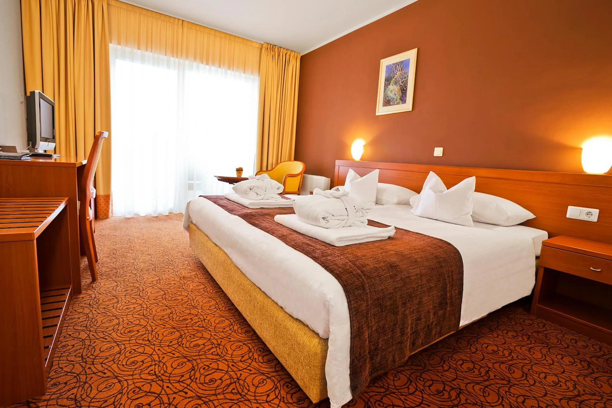 Bed in Spa & Wellness Hotel Pinia