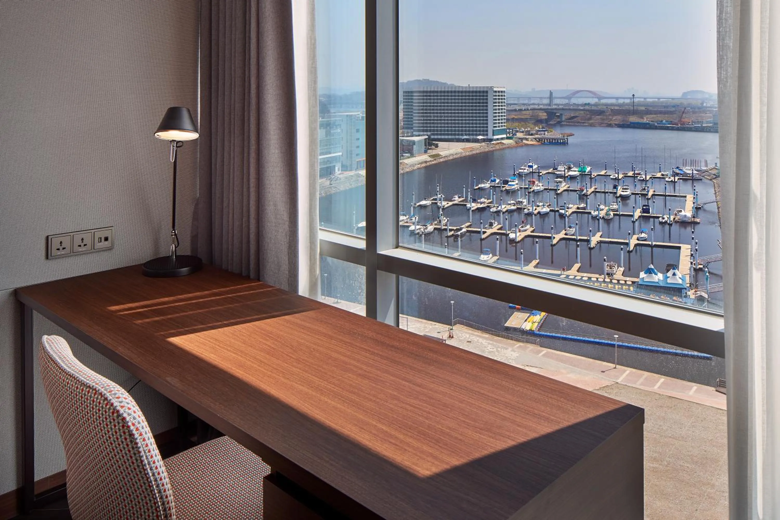 Bedroom in Ramada Encore by Wyndham Gimpo Han River Hotel