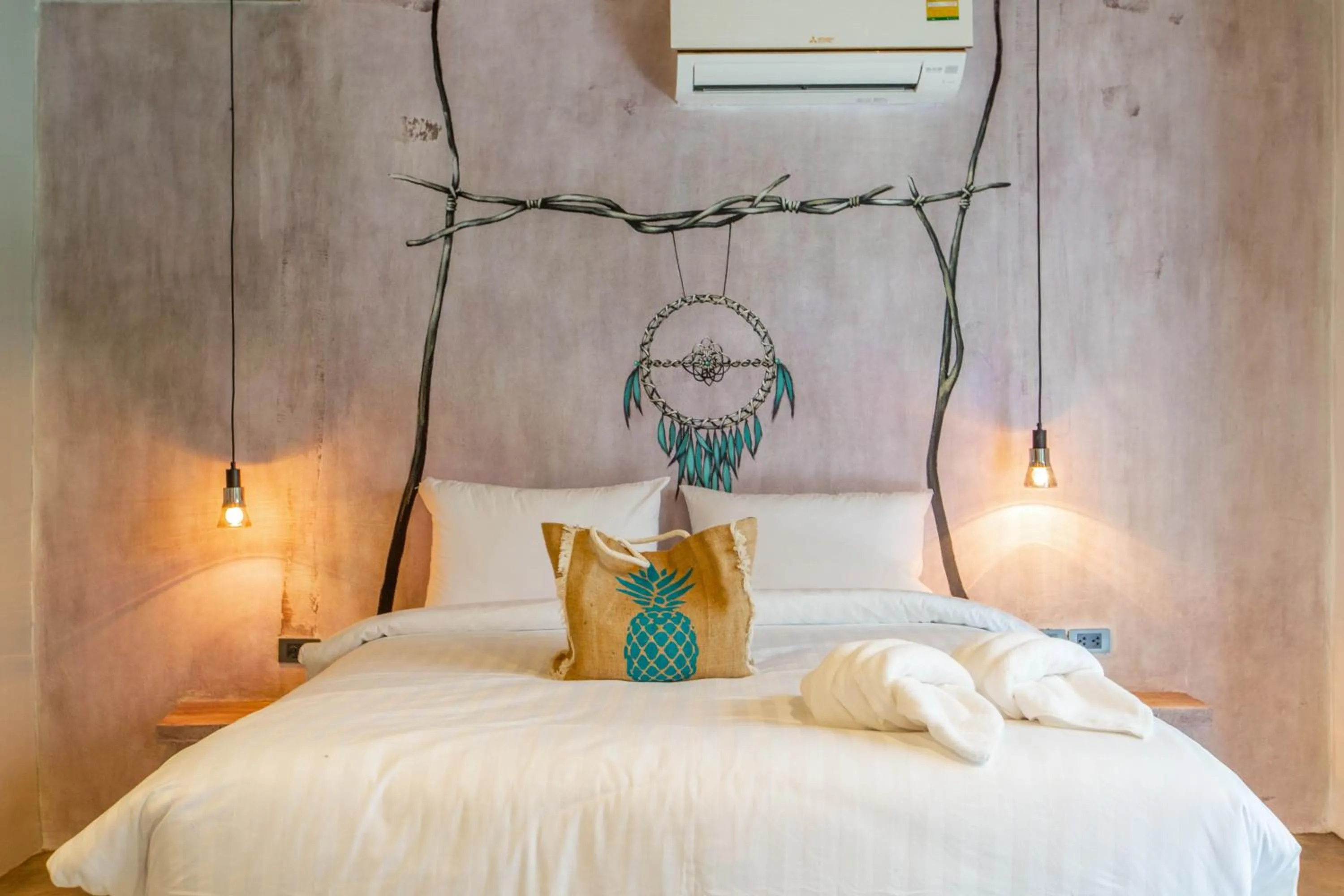 Bed in Dreamcatcher Boutique Hotel