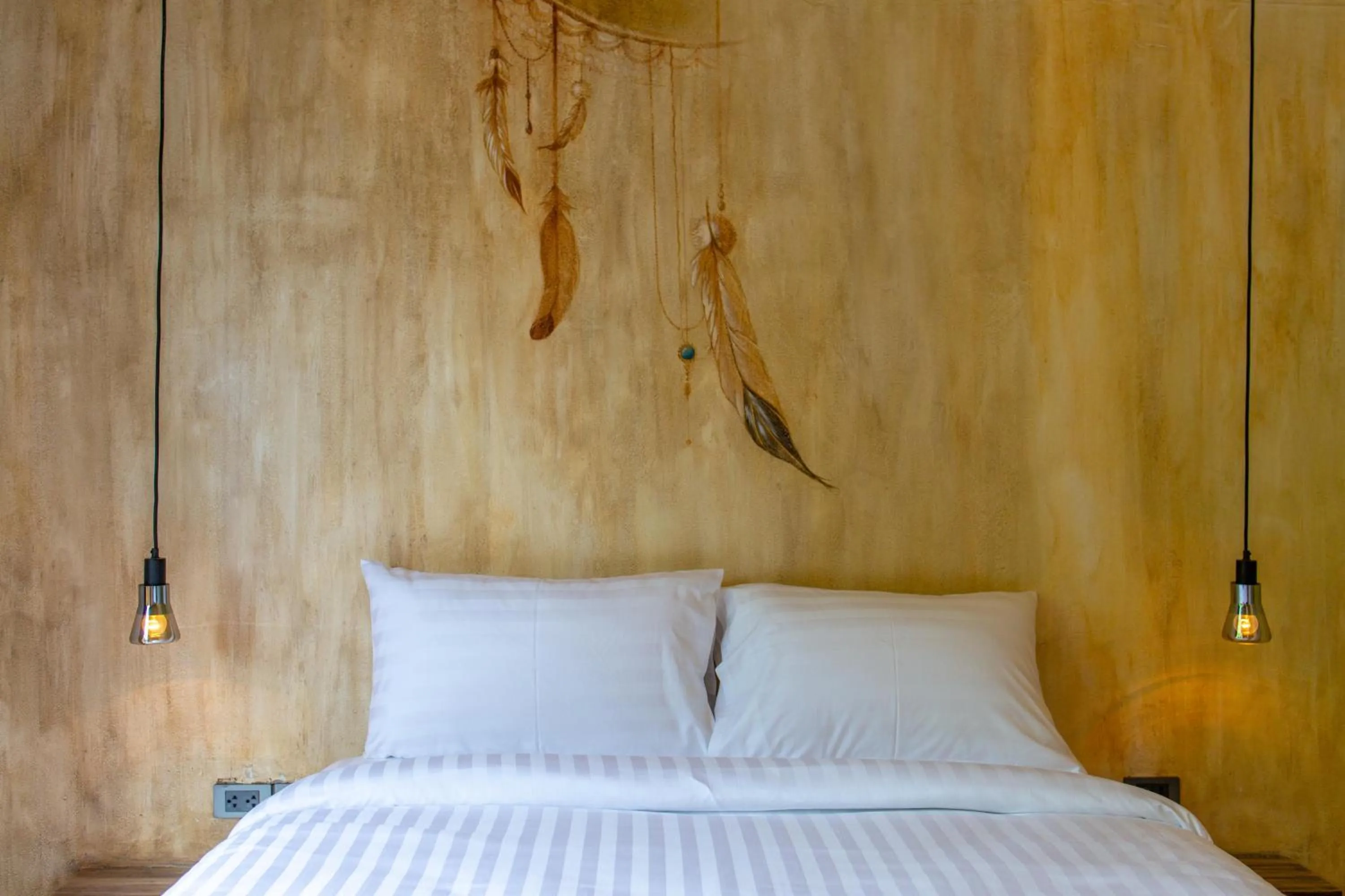 Bed in Dreamcatcher Boutique Hotel