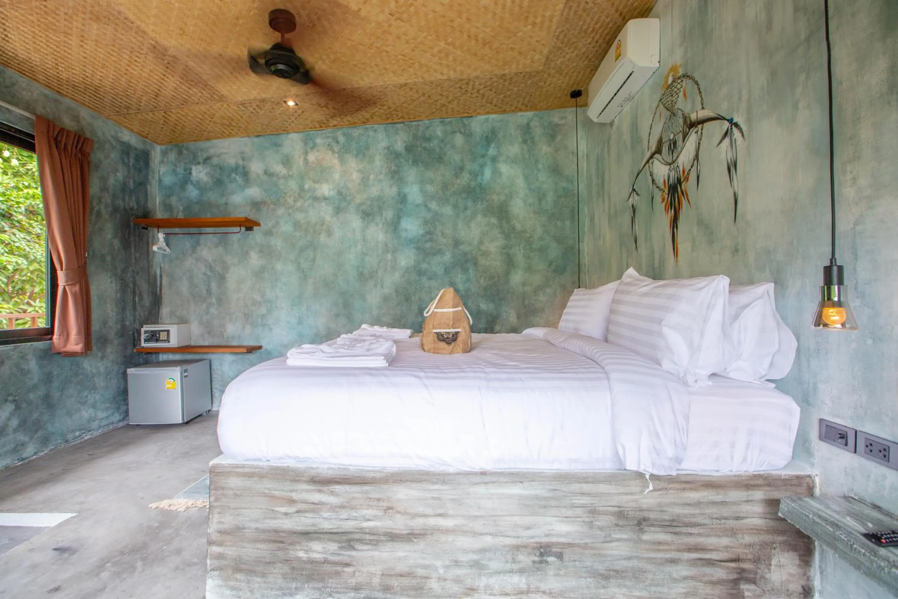 Bed in Dreamcatcher Boutique Hotel