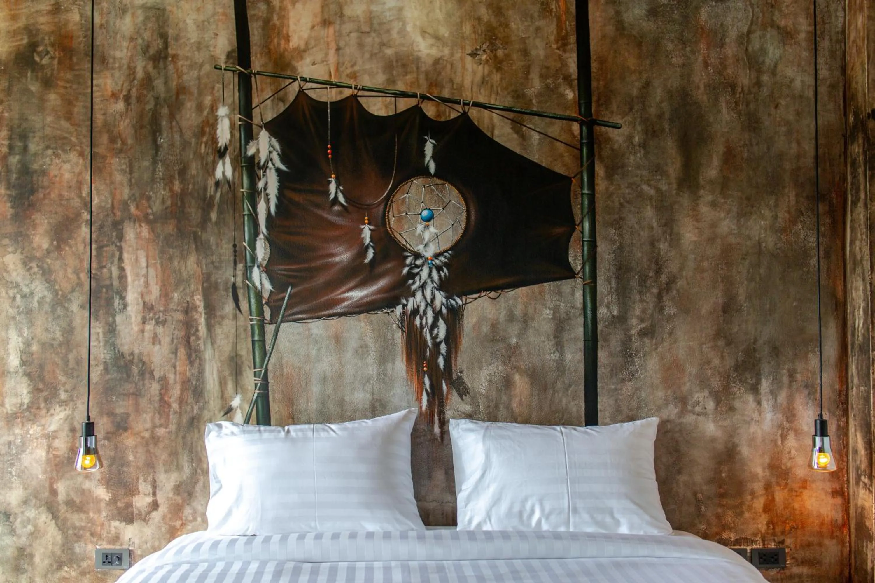Bed in Dreamcatcher Boutique Hotel