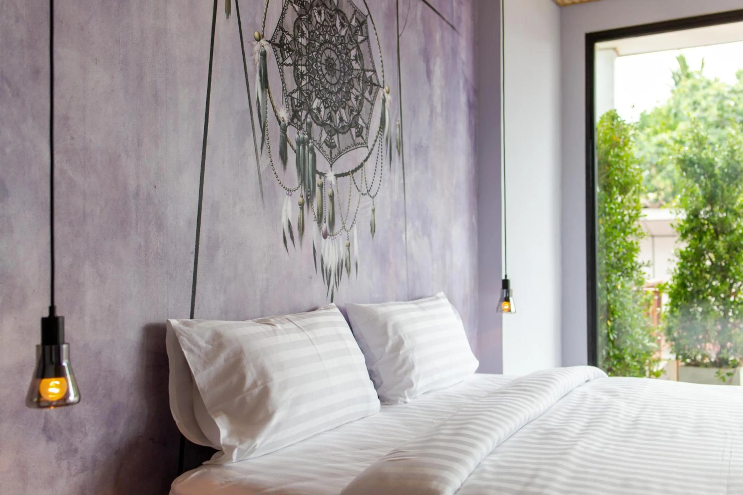 Bed in Dreamcatcher Boutique Hotel