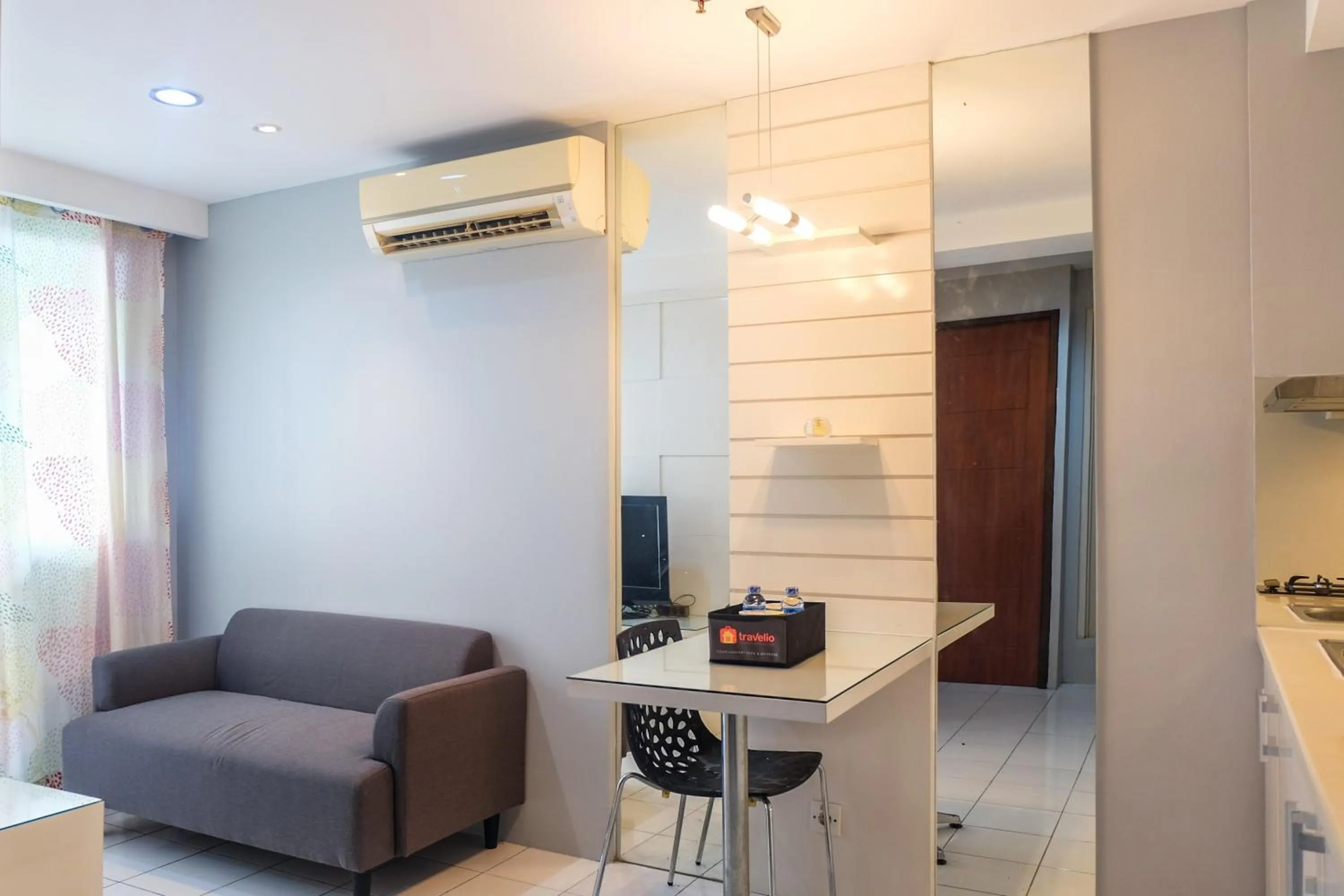 Living room in Best Price and Minimalist 2BR Kebagusan City Apartment By Travelio