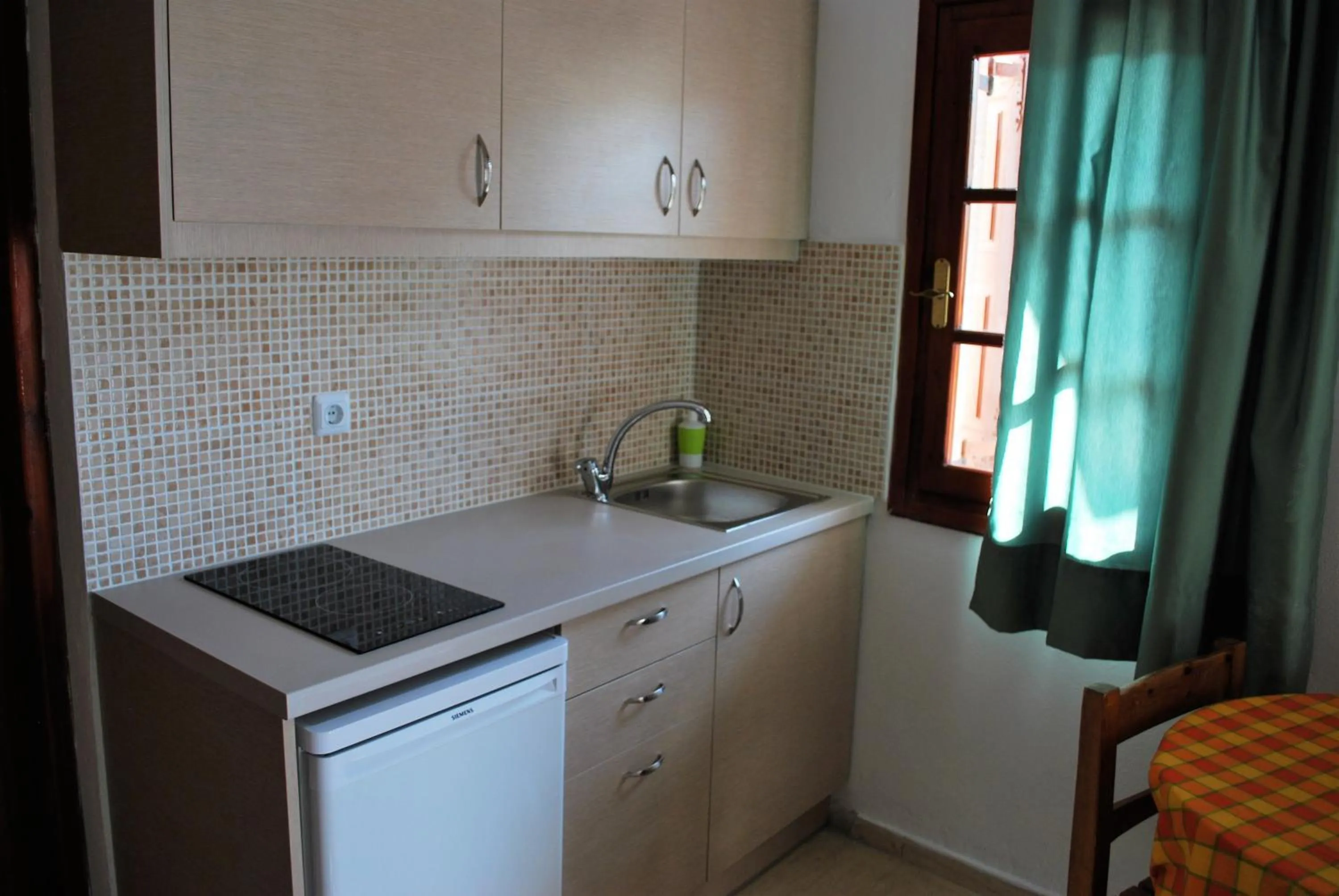 Kitchen or kitchenette in Koula Apartments