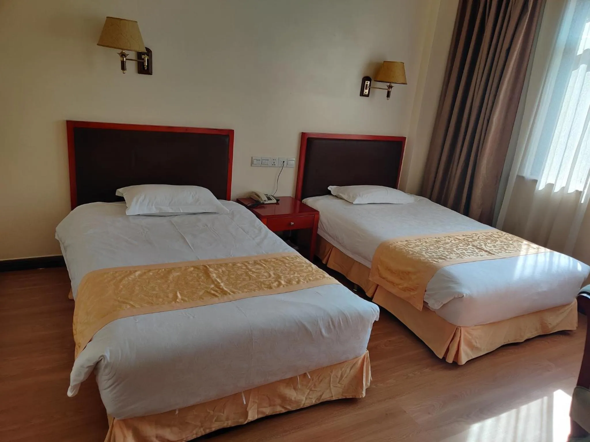 Bed in Soluxe Club International Hotel