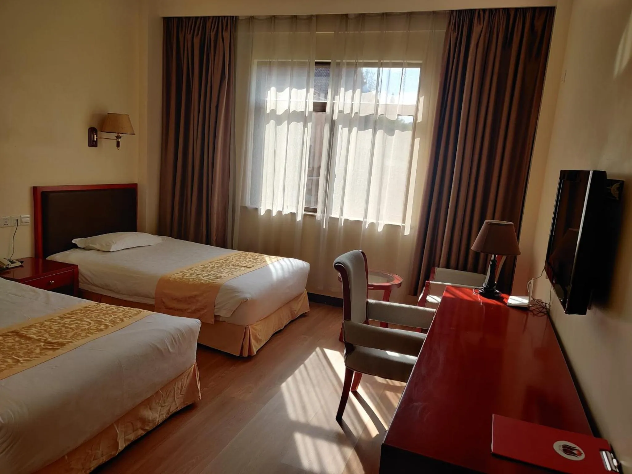 Bed in Soluxe Club International Hotel