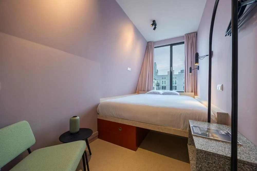 Bed in hotel emma next