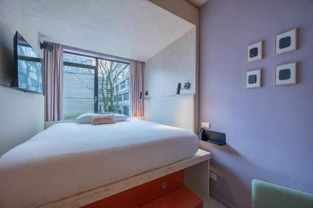 Bed in hotel emma next