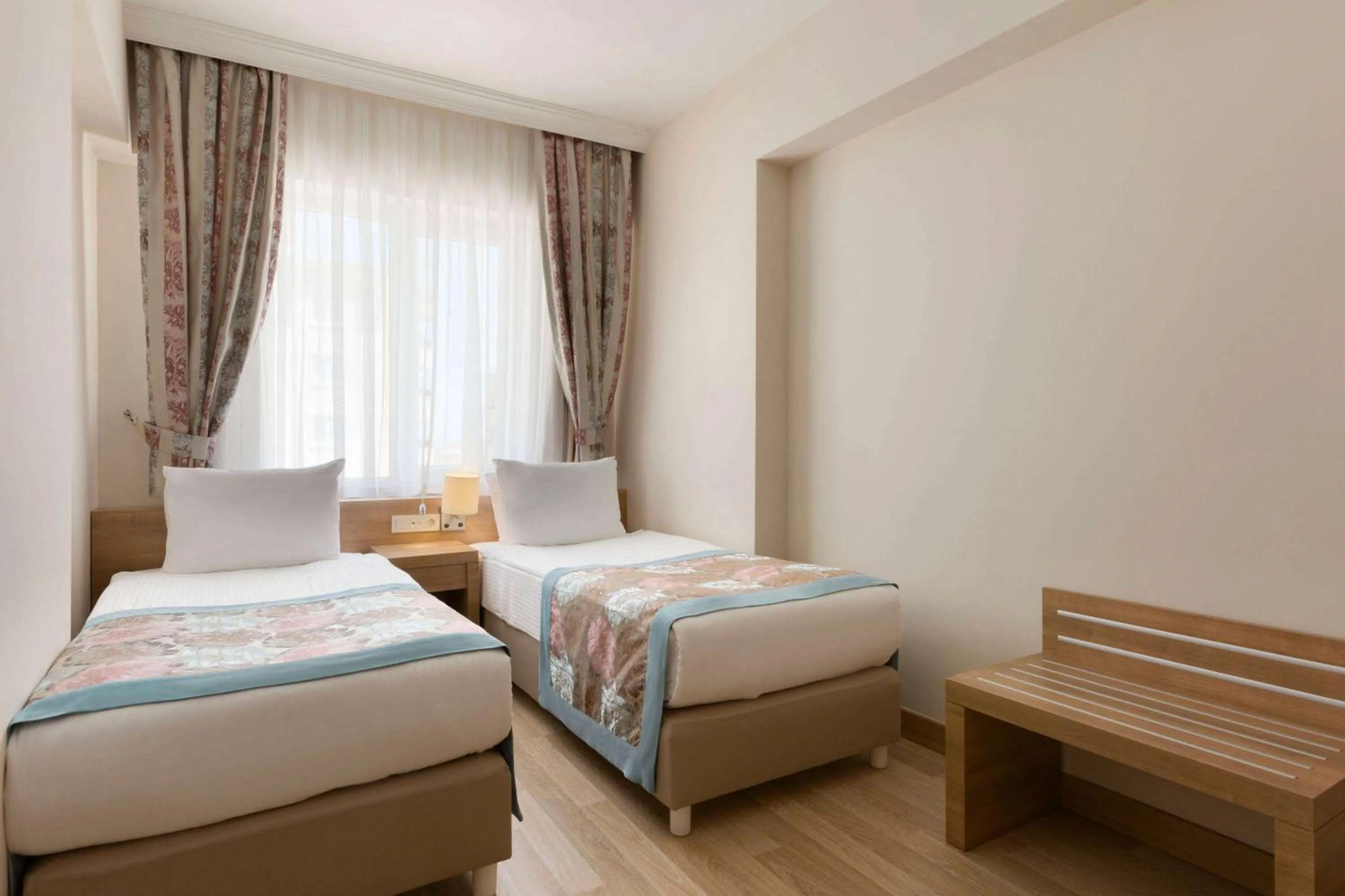 Bed in Ramada Resort By Wyndham Lara