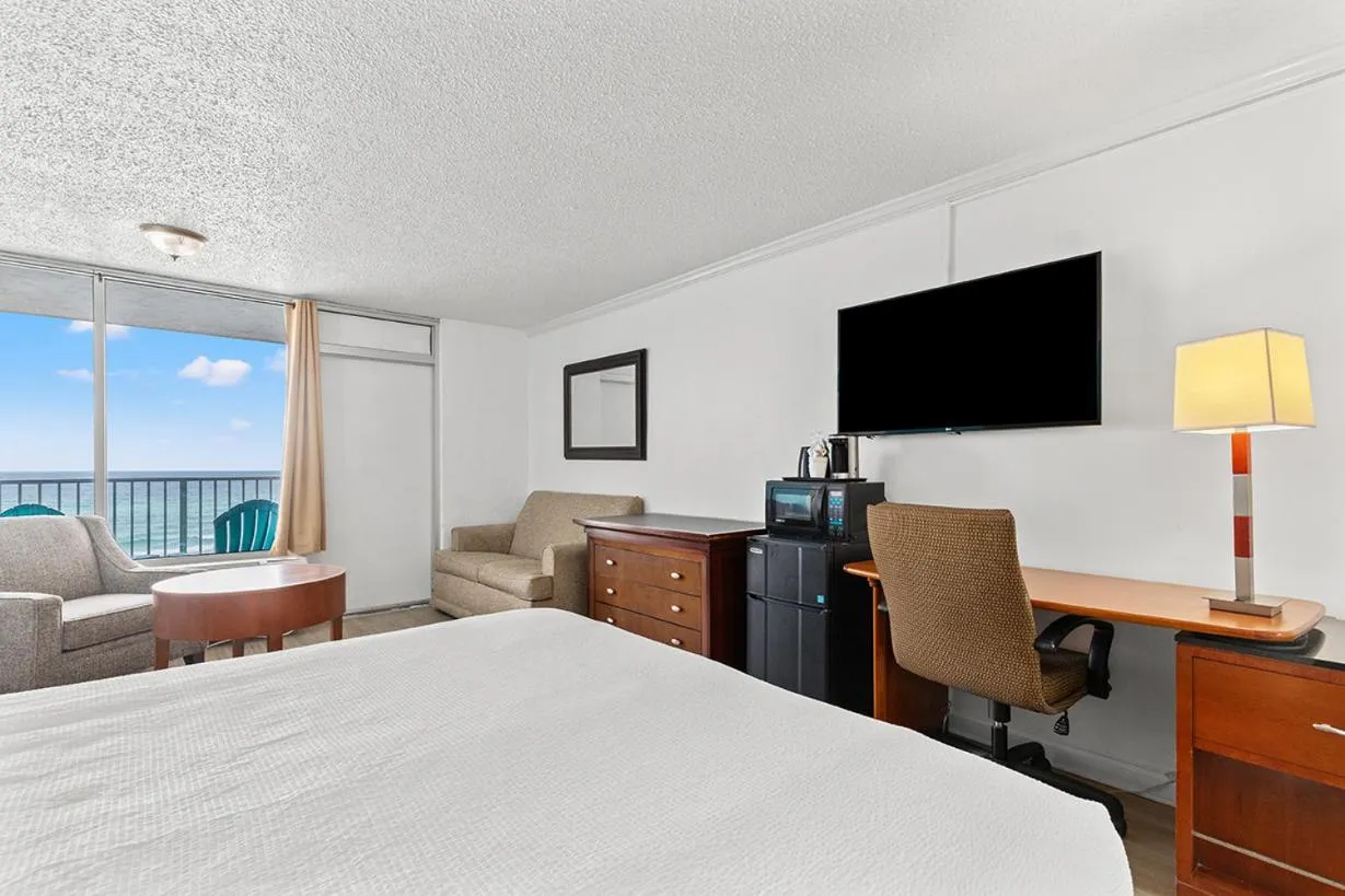 Photo of the whole room, Bed in The Reef At Seahaven Beach Resorts