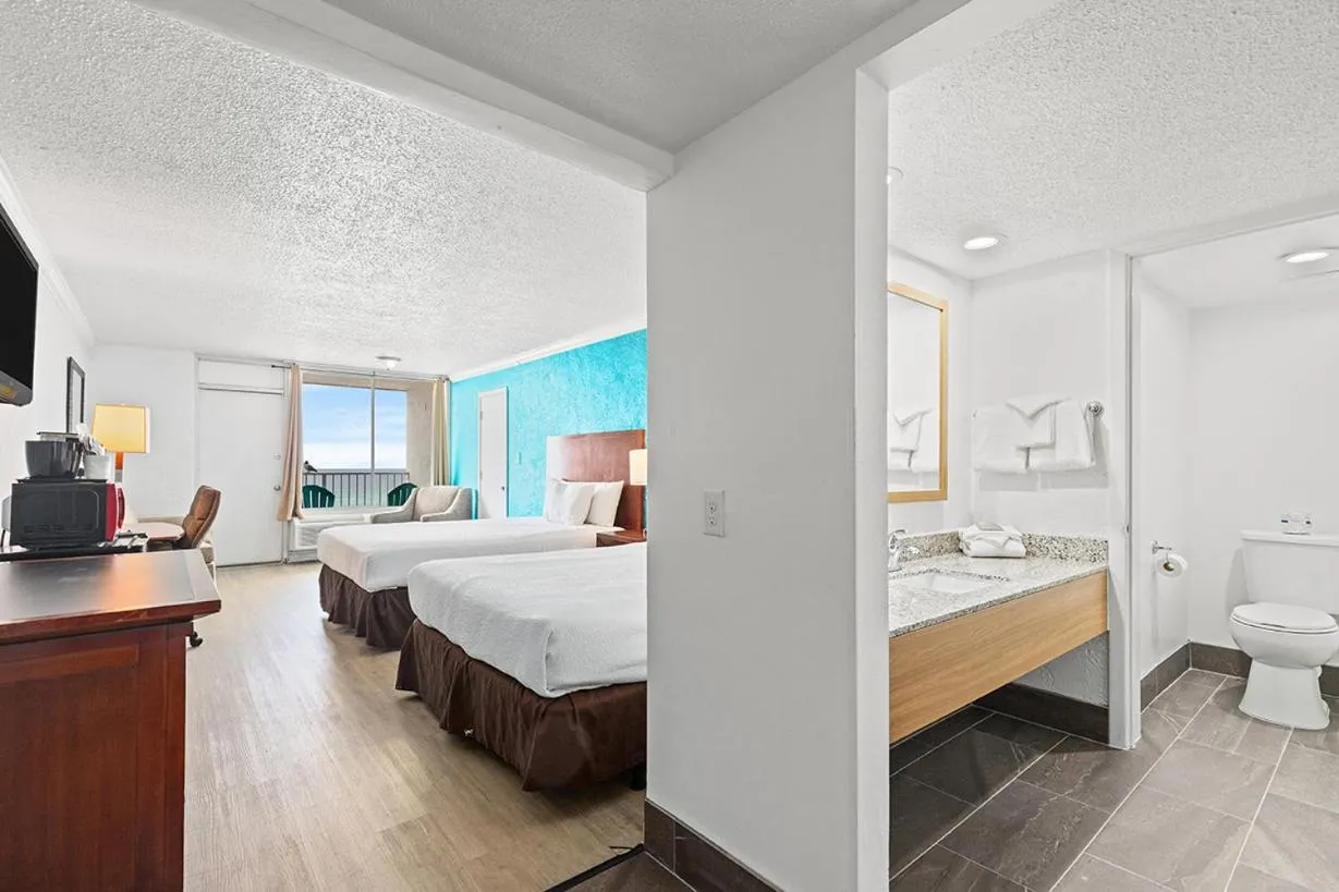 Photo of the whole room, Bed in The Reef At Seahaven Beach Resorts