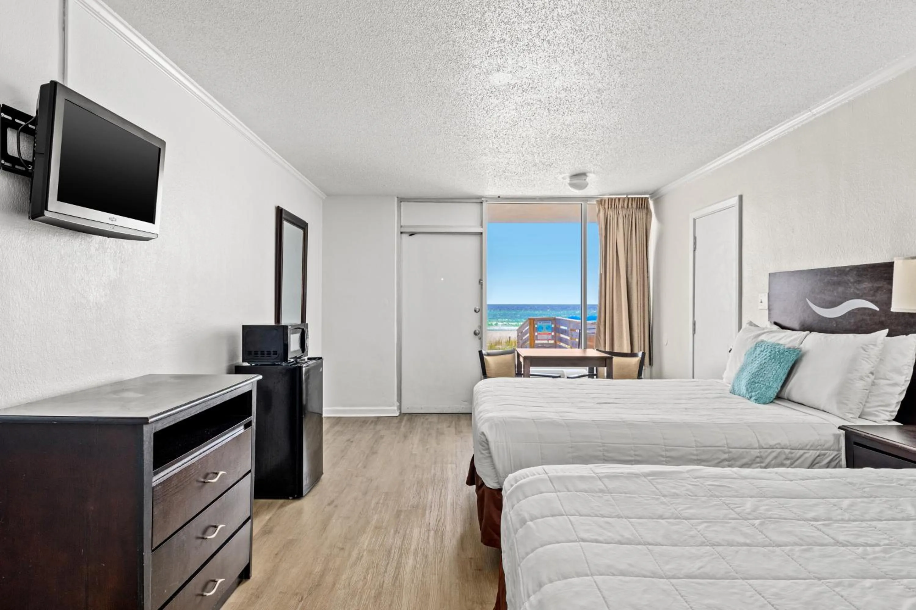 Photo of the whole room, Bed in The Reef At Seahaven Beach Resorts