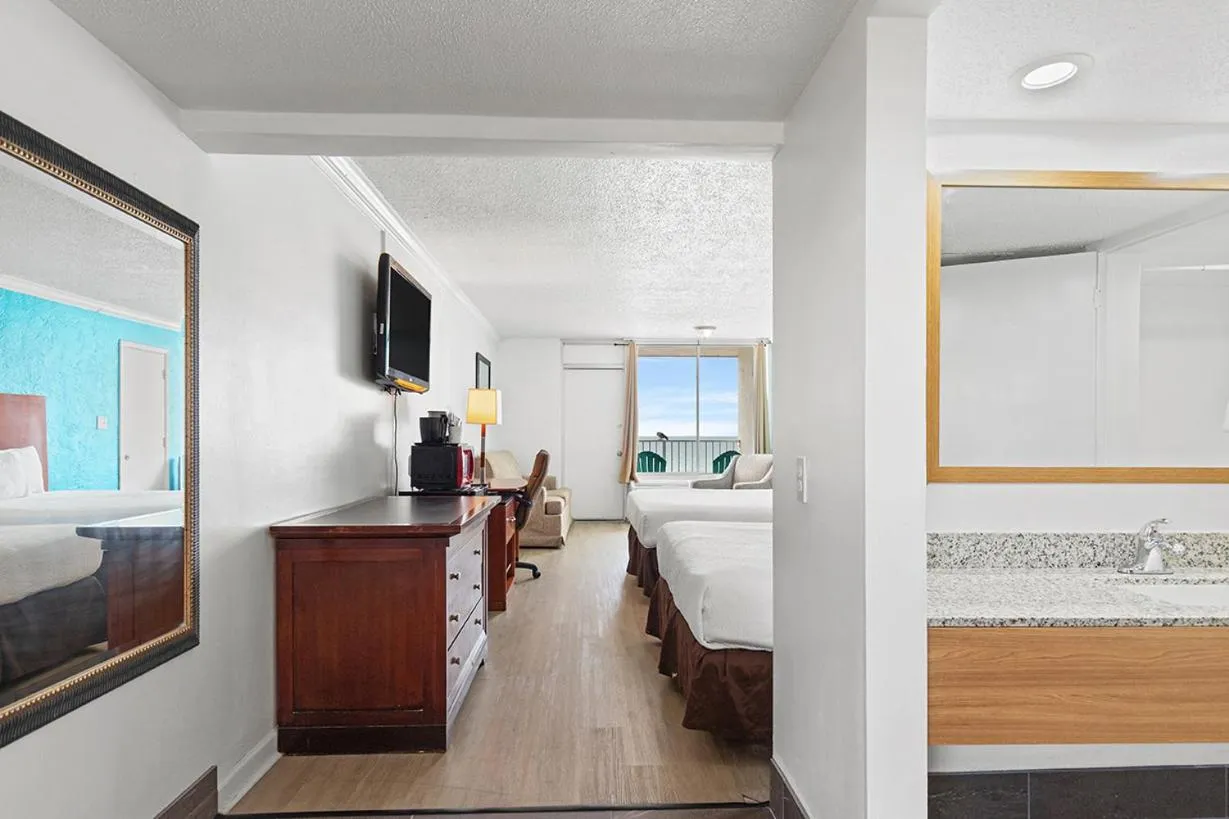 Photo of the whole room, Bed in The Reef At Seahaven Beach Resorts