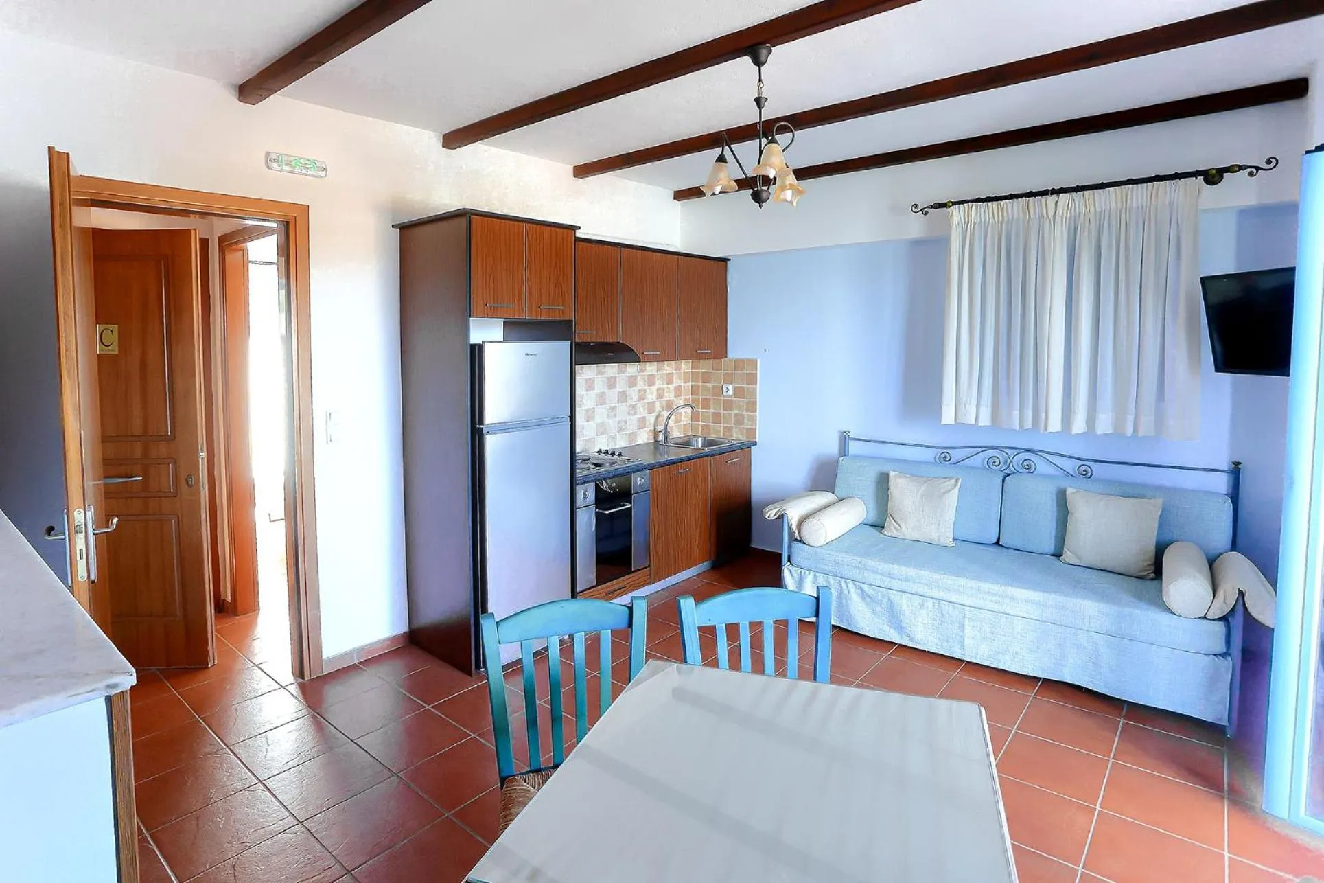 Kitchen or kitchenette, Bed in Vathi Hotel Apartment Hotel
