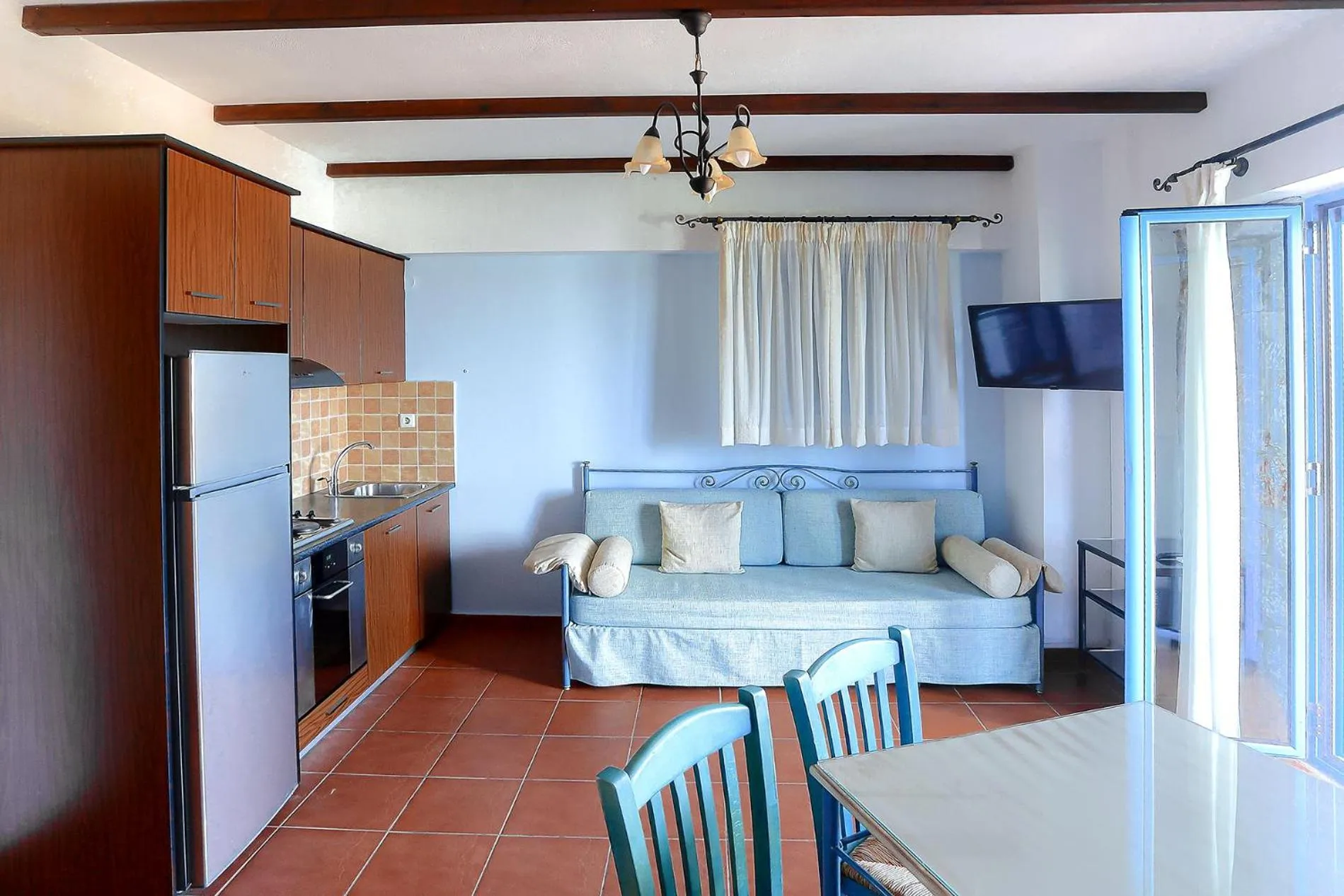 Seating area, Bed in Vathi Hotel Apartment Hotel