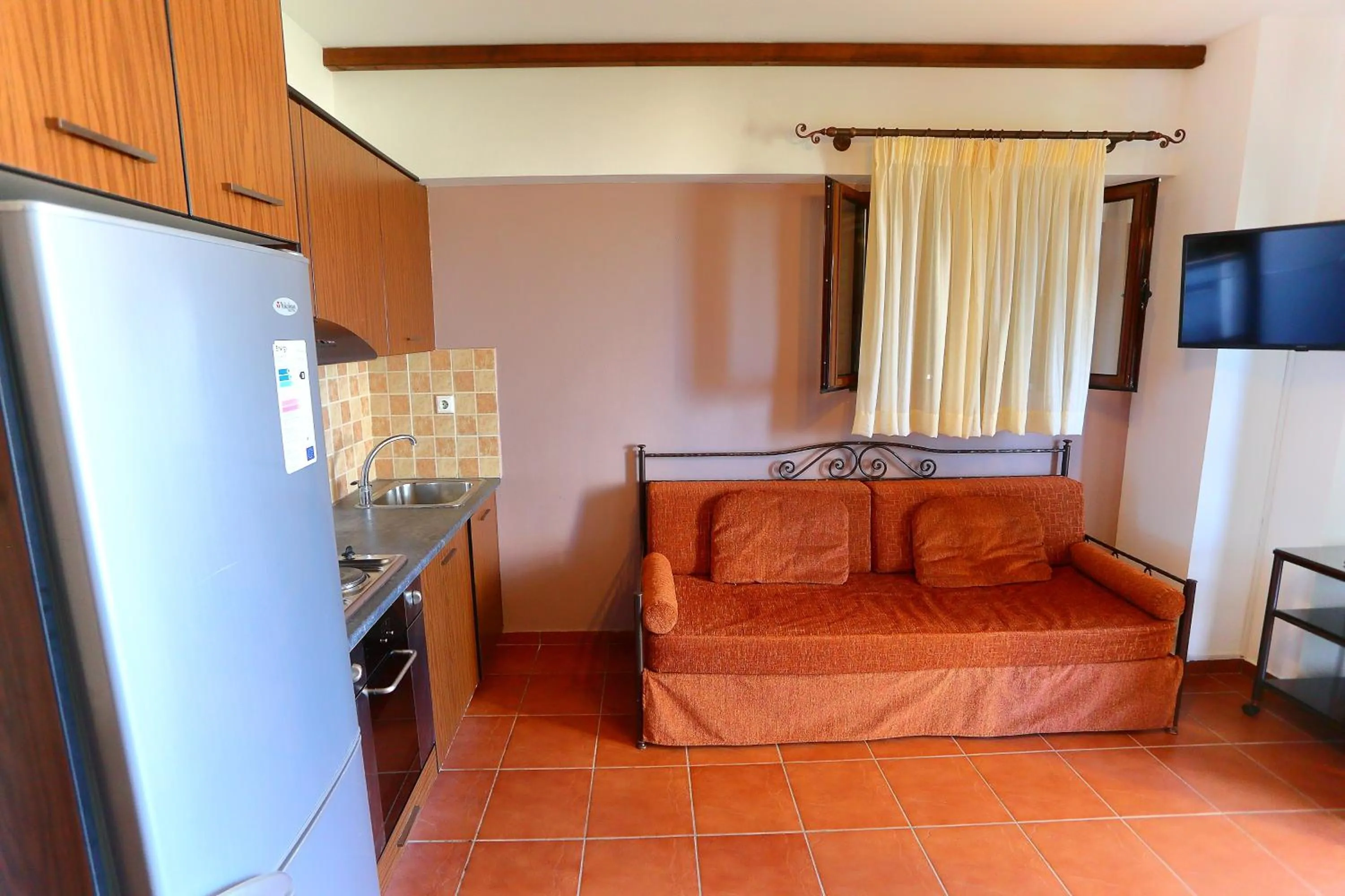 Seating area, Bed in Vathi Hotel Apartment Hotel