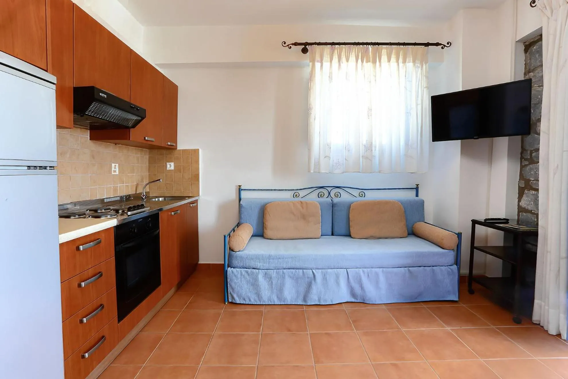 Seating area, Bed in Vathi Hotel Apartment Hotel