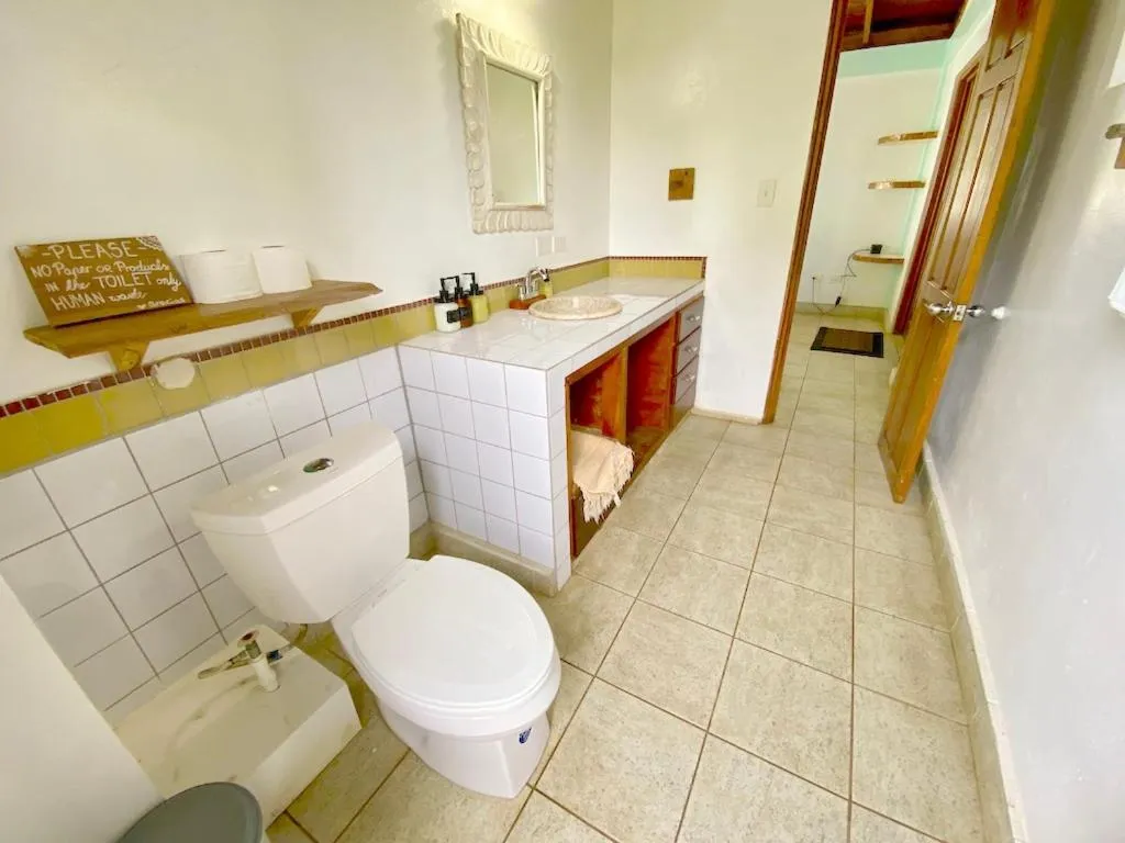 Toilet in Bird Island Bungalows