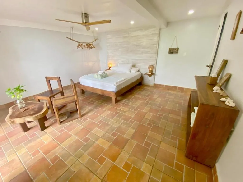 Bed in Bird Island Bungalows