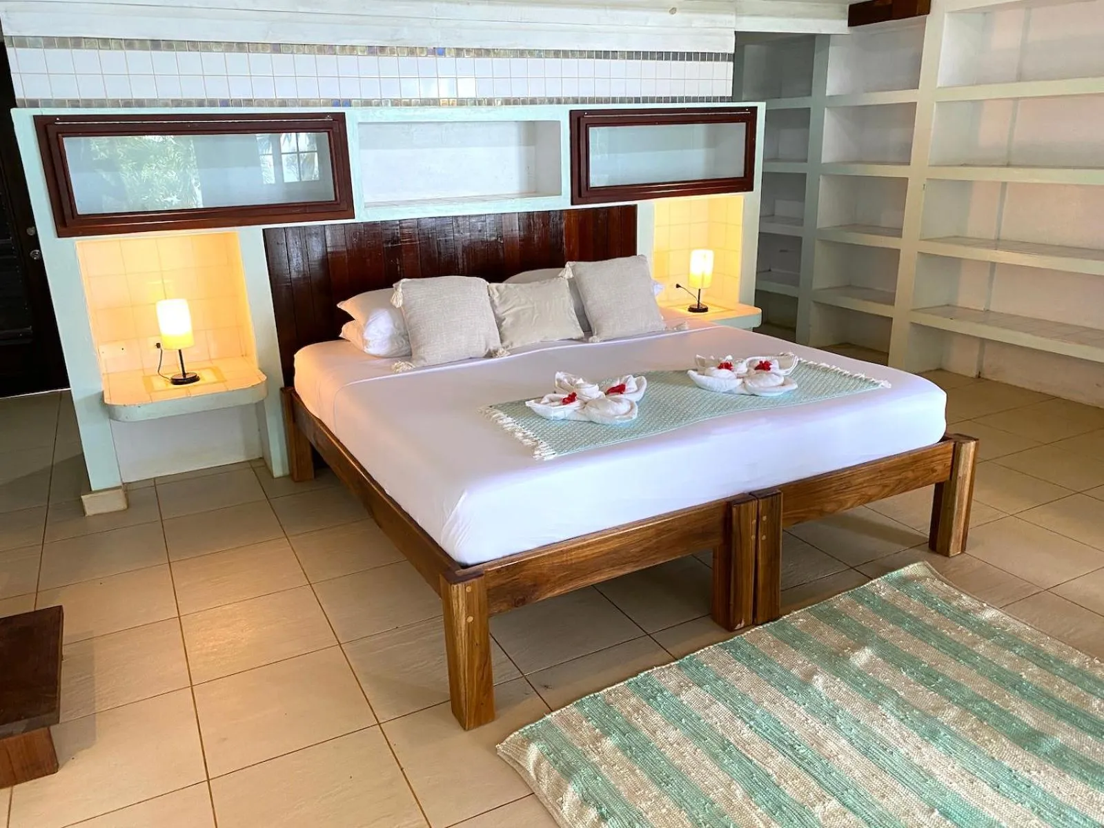Bed in Bird Island Bungalows