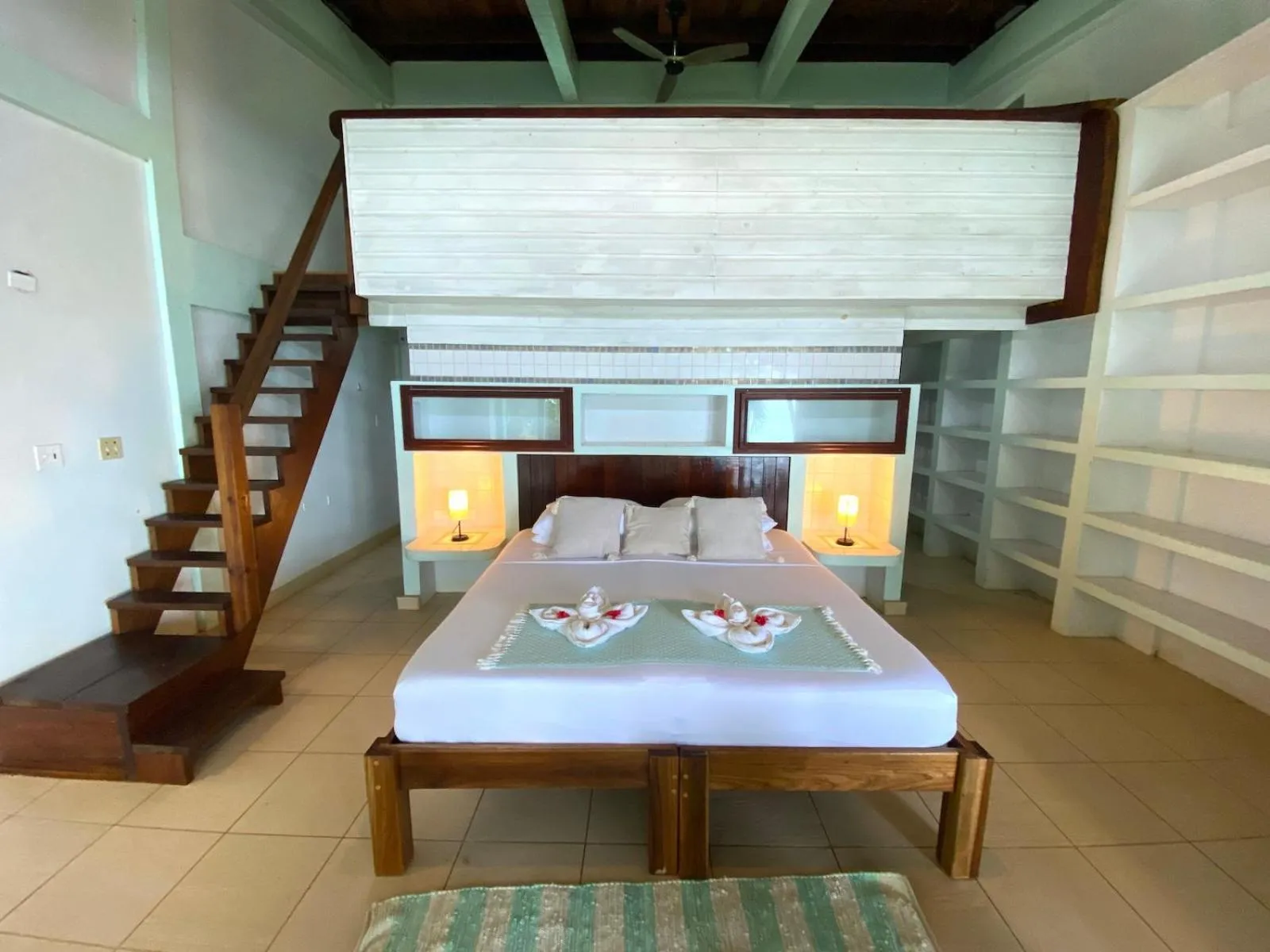 Bed in Bird Island Bungalows