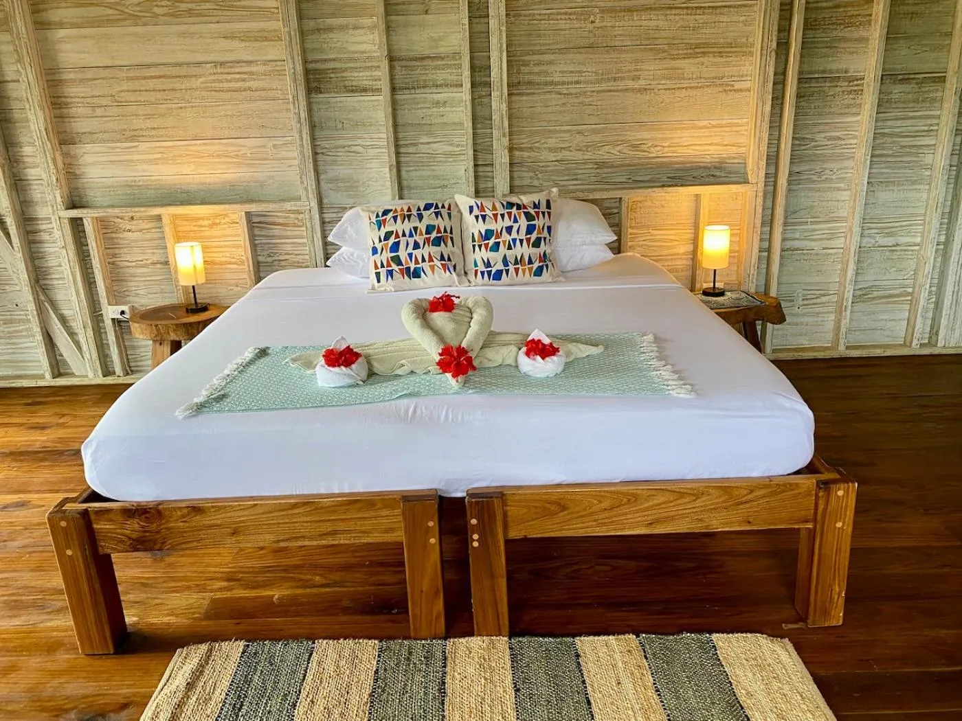 Bed in Bird Island Bungalows