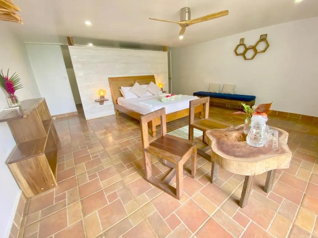 Photo of the whole room, Bed in Bird Island Bungalows