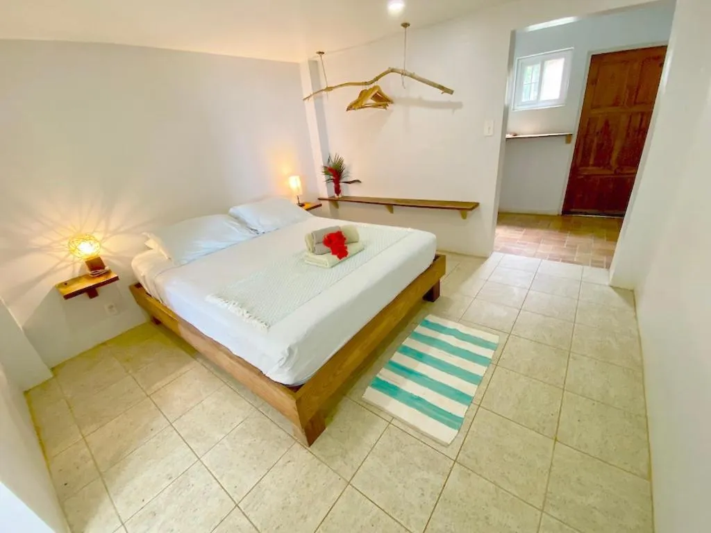 Bed in Bird Island Bungalows