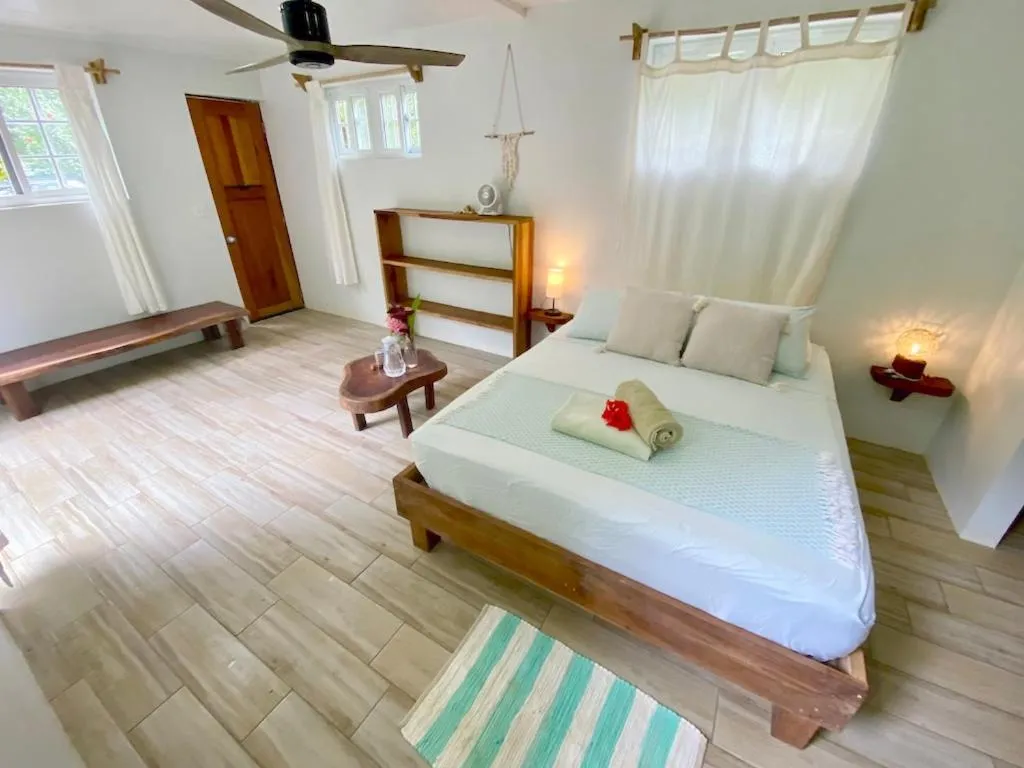 Bed in Bird Island Bungalows