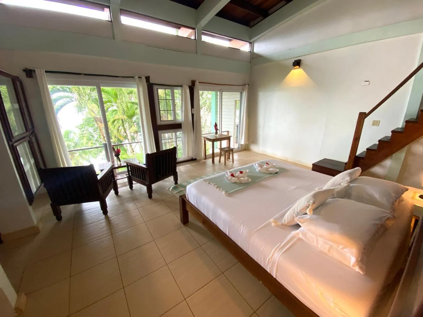 Bed in Bird Island Bungalows