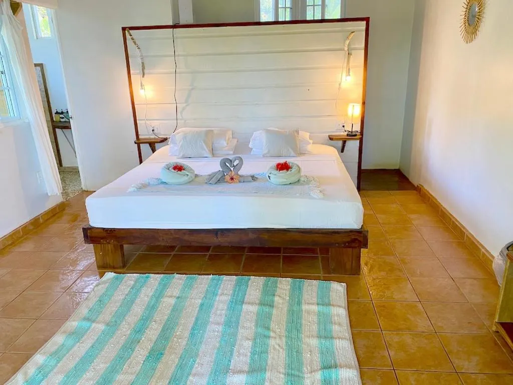 Photo of the whole room, Bed in Bird Island Bungalows